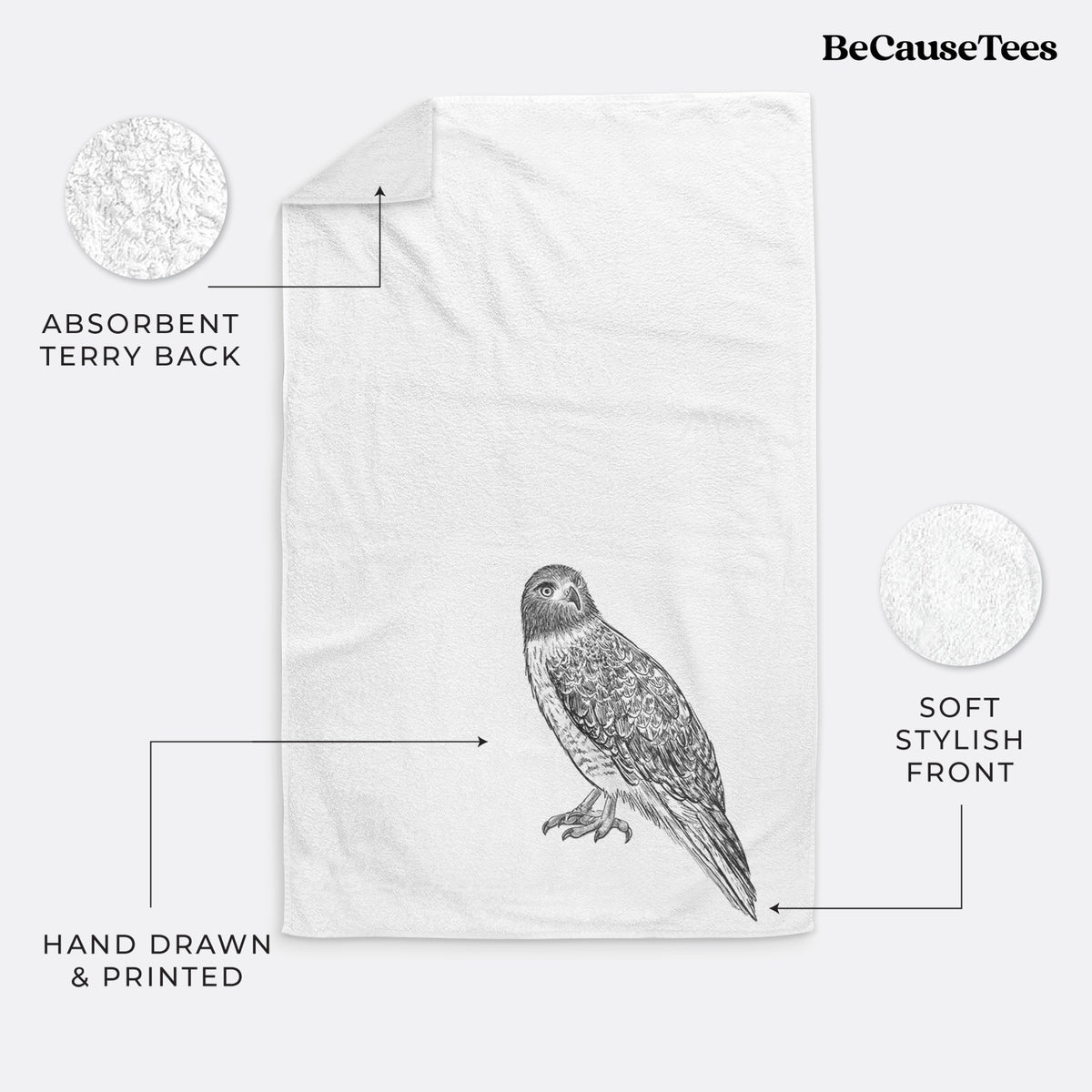 White hand towel printed with a detailed black ink illustration of a red-tailed hawk perched.
