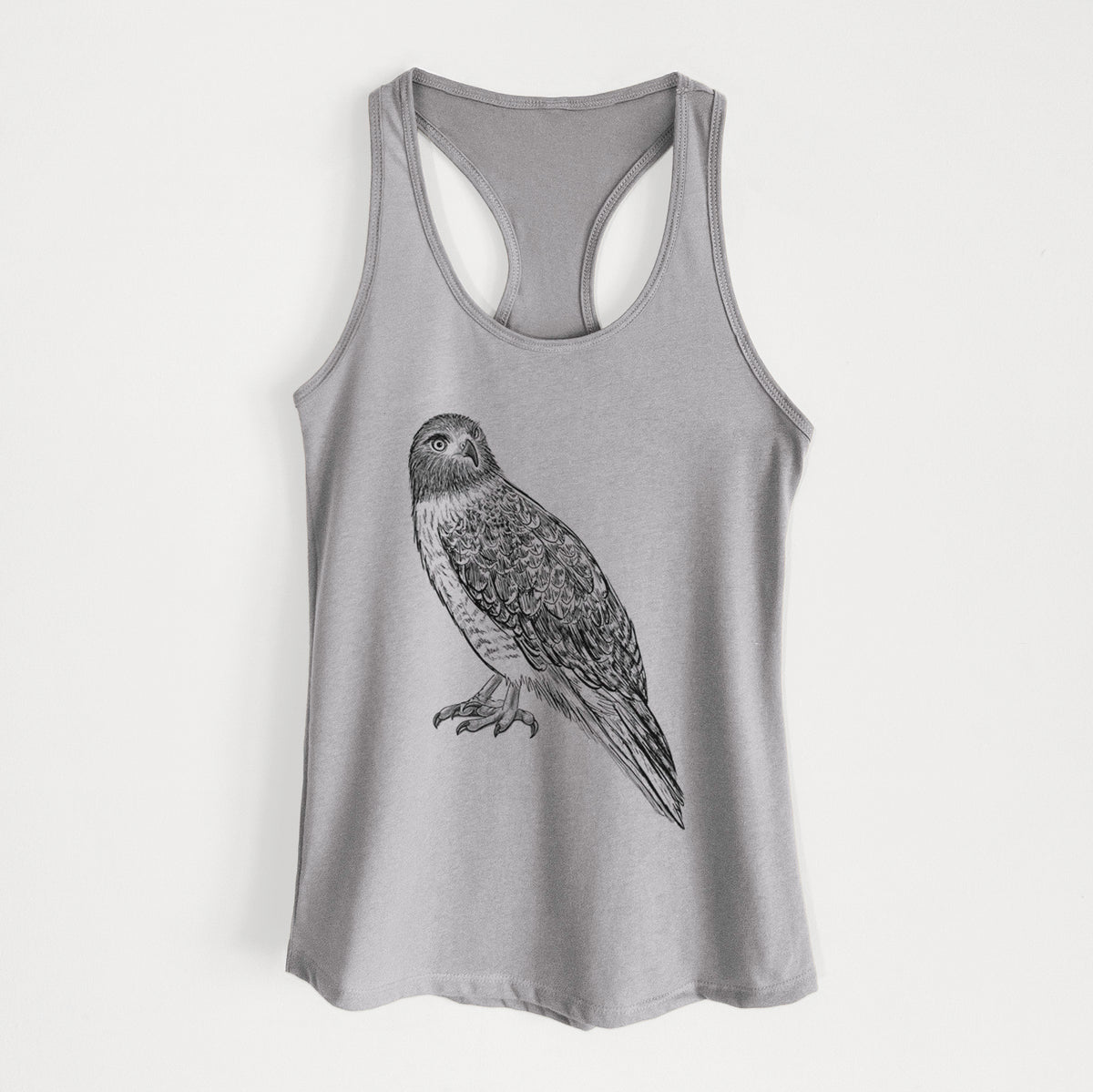 Heather grey women's racerback tank top laid flat, printed with a detailed black ink illustration of a red-tailed hawk perched.