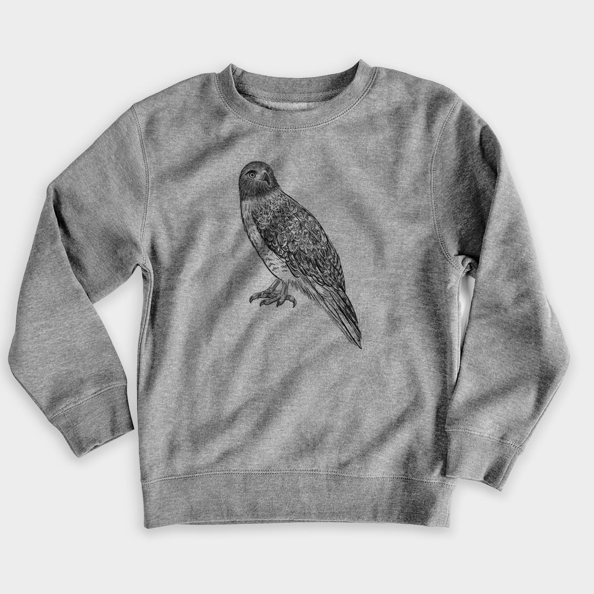 Nickel grey youth crewneck sweatshirt laid flat, printed with a detailed black ink illustration of a red-tailed hawk perched.