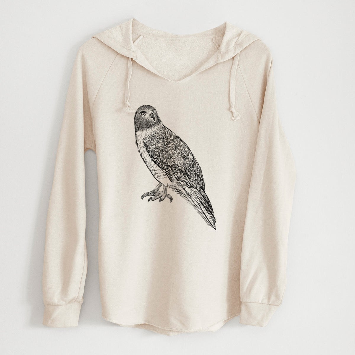 Bone cream women's Cali Wave hooded sweatshirt laid flat, printed with a detailed black ink illustration of a red-tailed hawk perched.