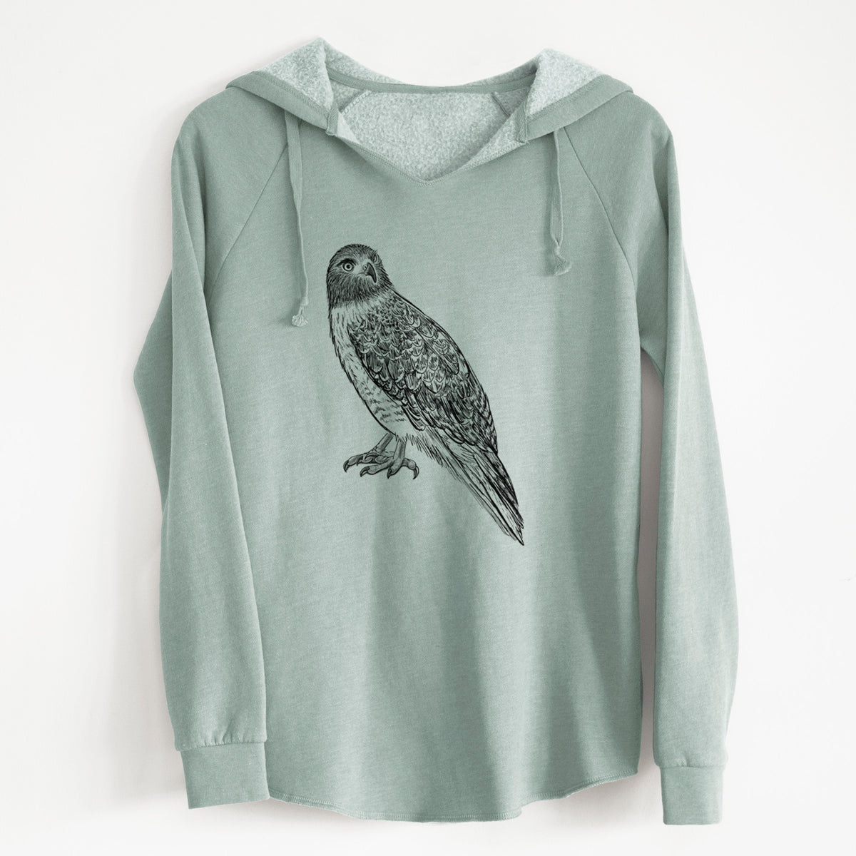 Sage green women's Cali Wave hooded sweatshirt laid flat, printed with a detailed black ink illustration of a red-tailed hawk perched.