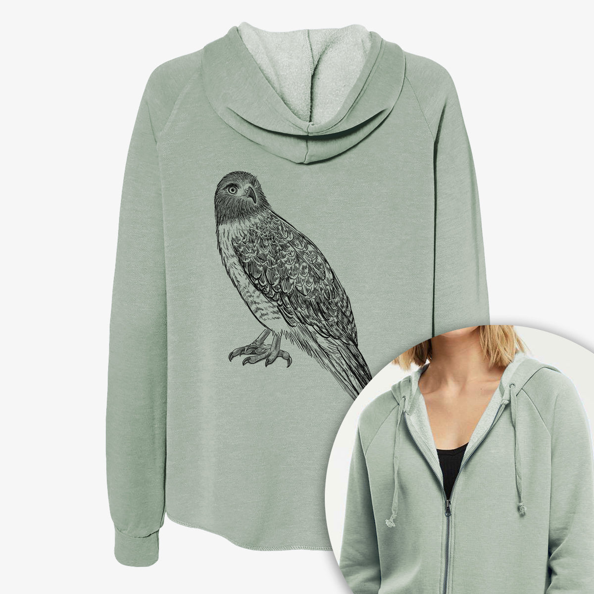 Women's Cali Wave zip-up sweatshirt printed with a detailed black ink illustration of a red-tailed hawk perched, with a close-up of the zipper.