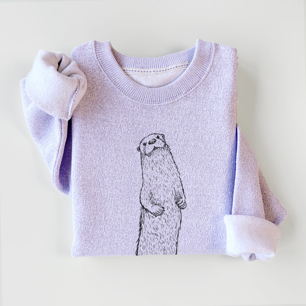 Ice purple knit sweatshirt printed with a black ink illustration of a river otter standing upright on a rock, styled flat.