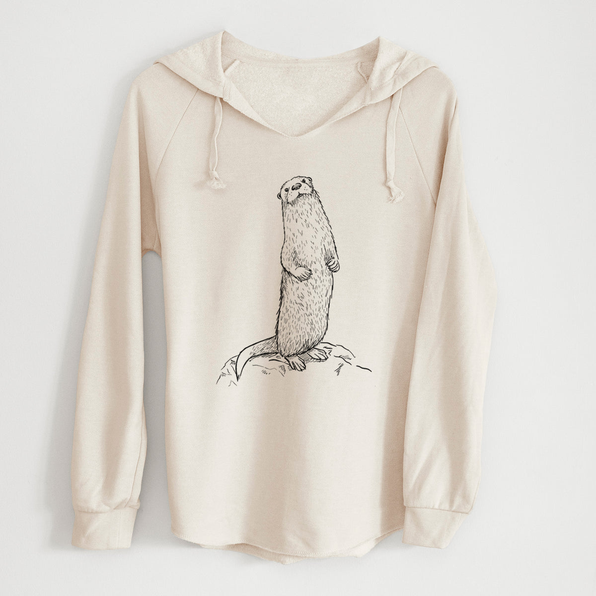 Bone cream women's Cali Wave hooded sweatshirt laid flat, printed with a black ink illustration of a river otter standing upright on a rock.