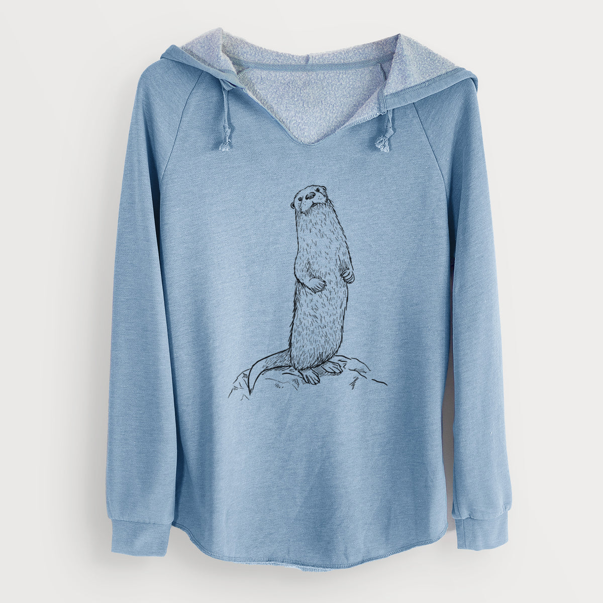 Misty blue women's Cali Wave hooded sweatshirt laid flat, printed with a black ink illustration of a river otter standing upright on a rock.