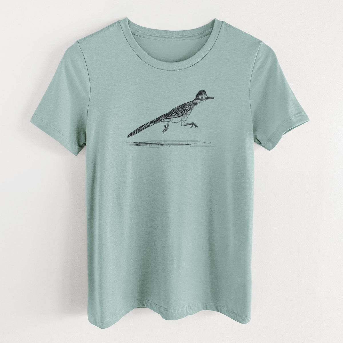 Dusty blue women's relaxed fit cotton t-shirt laid flat, printed with a black ink illustration of a roadrunner running.