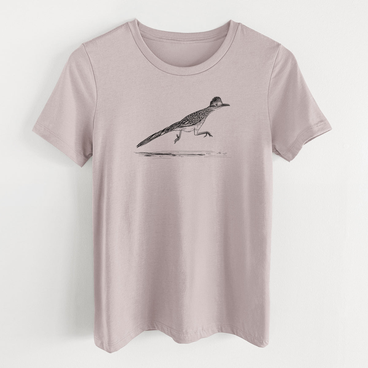 Pink gravel women's relaxed fit cotton t-shirt laid flat, printed with a black ink illustration of a roadrunner running.