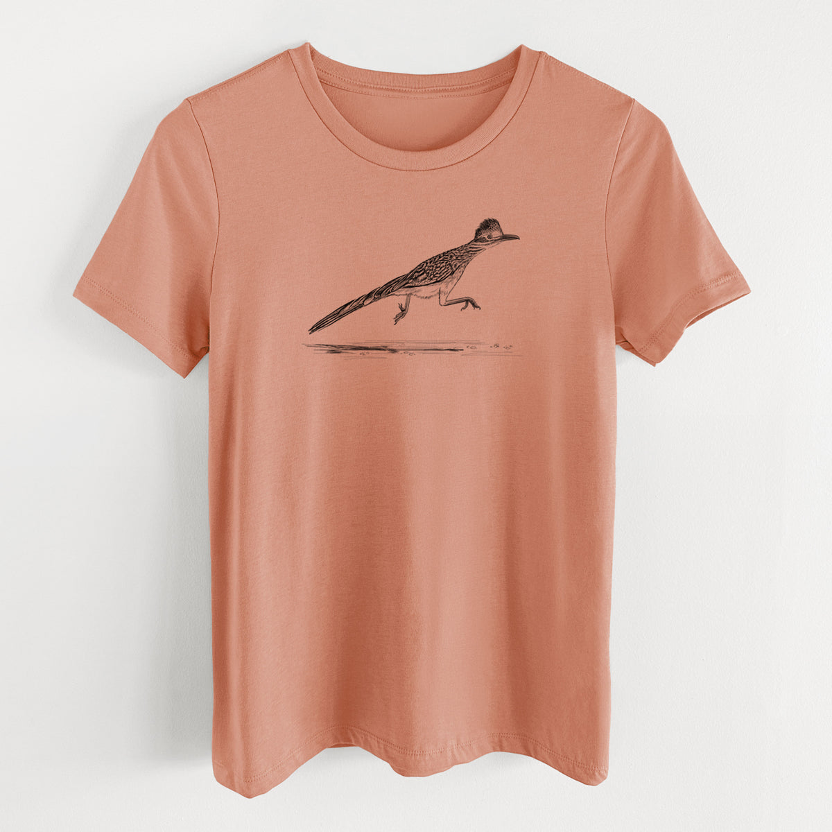 Terracotta orange women's relaxed fit cotton t-shirt laid flat, printed with a black ink illustration of a roadrunner running.