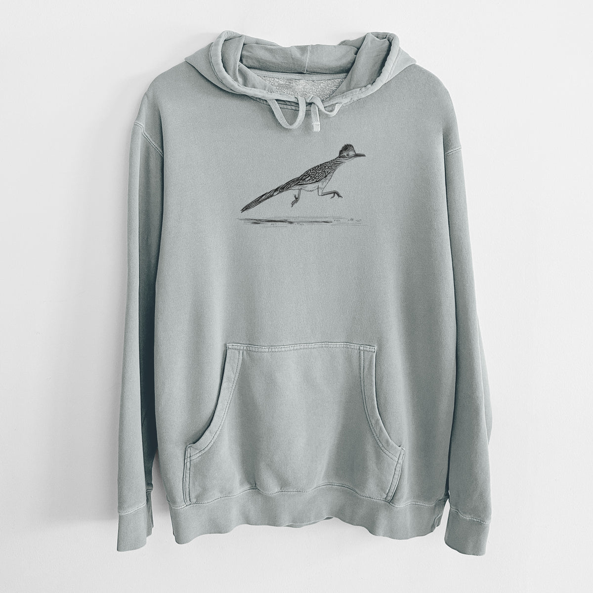 Sage green pigment dyed hoodie laid flat, printed with a black ink illustration of a roadrunner running.