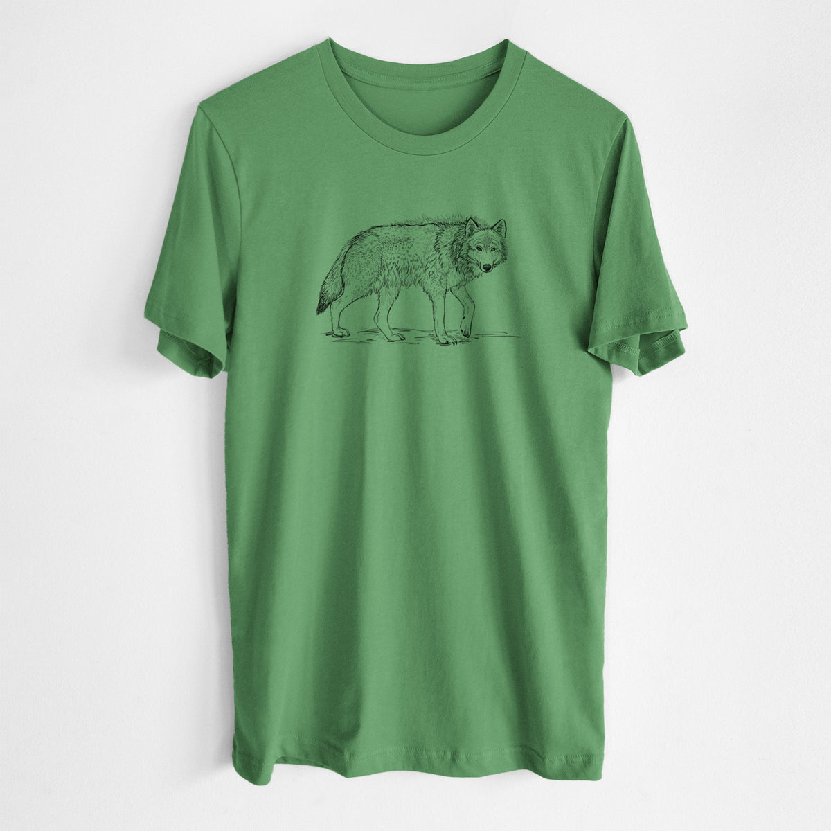 Leaf green lightweight cotton t-shirt laid flat, printed with a detailed black ink illustration of a grey wolf walking.