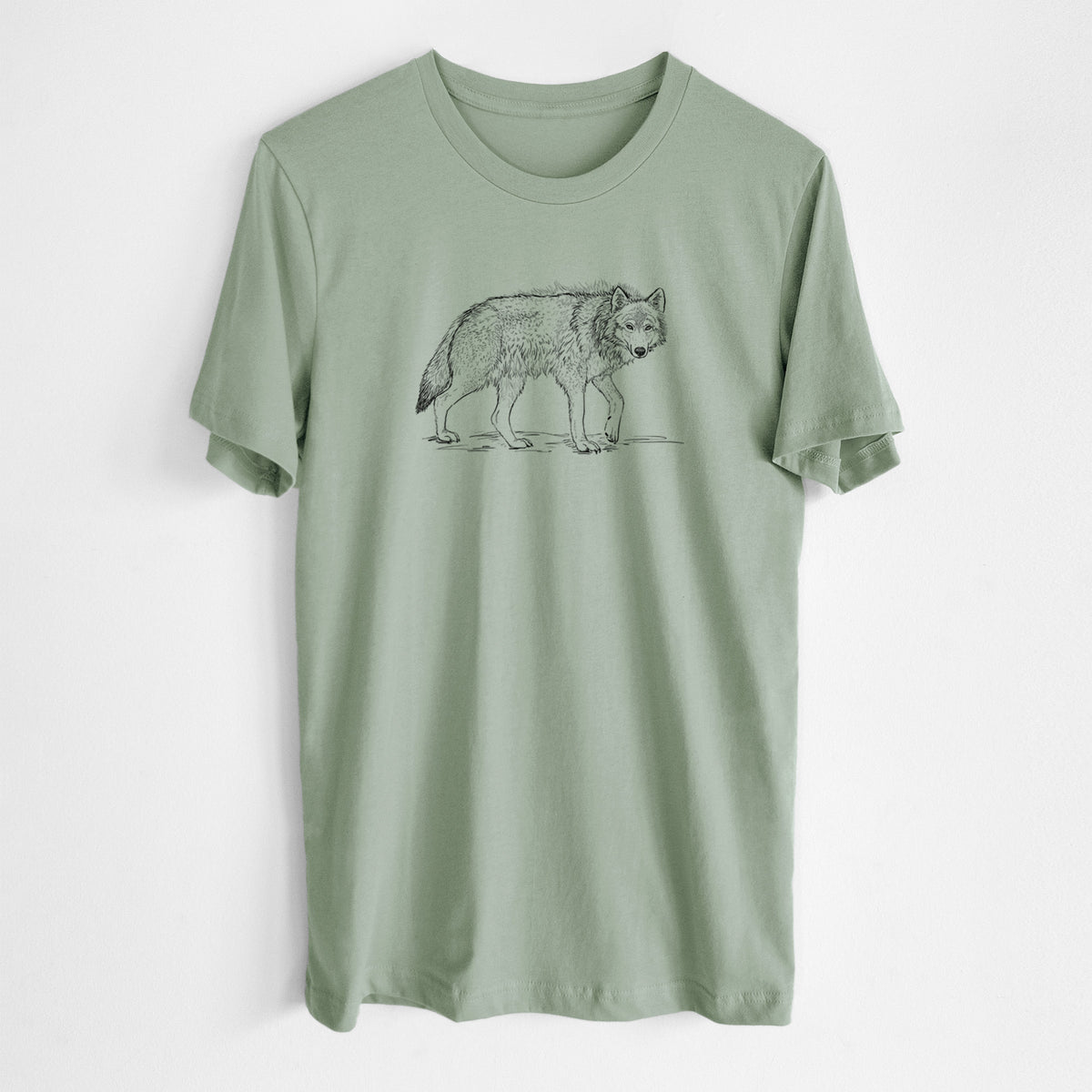 Sage green lightweight cotton t-shirt laid flat, printed with a detailed black ink illustration of a grey wolf walking.