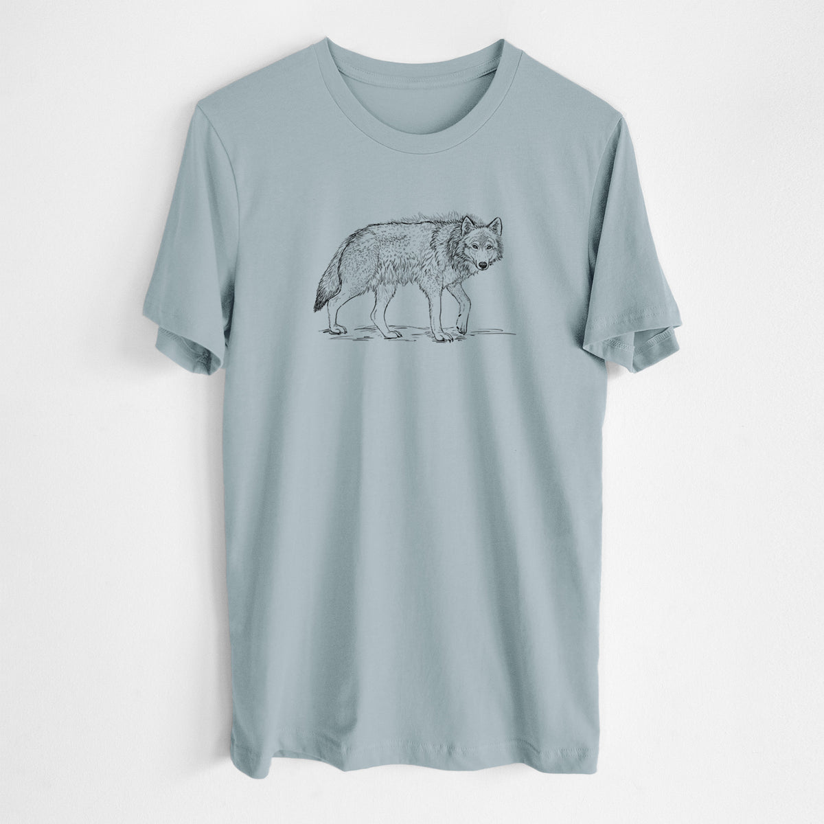 Vintage denim lightweight cotton t-shirt laid flat, printed with a detailed black ink illustration of a grey wolf walking.