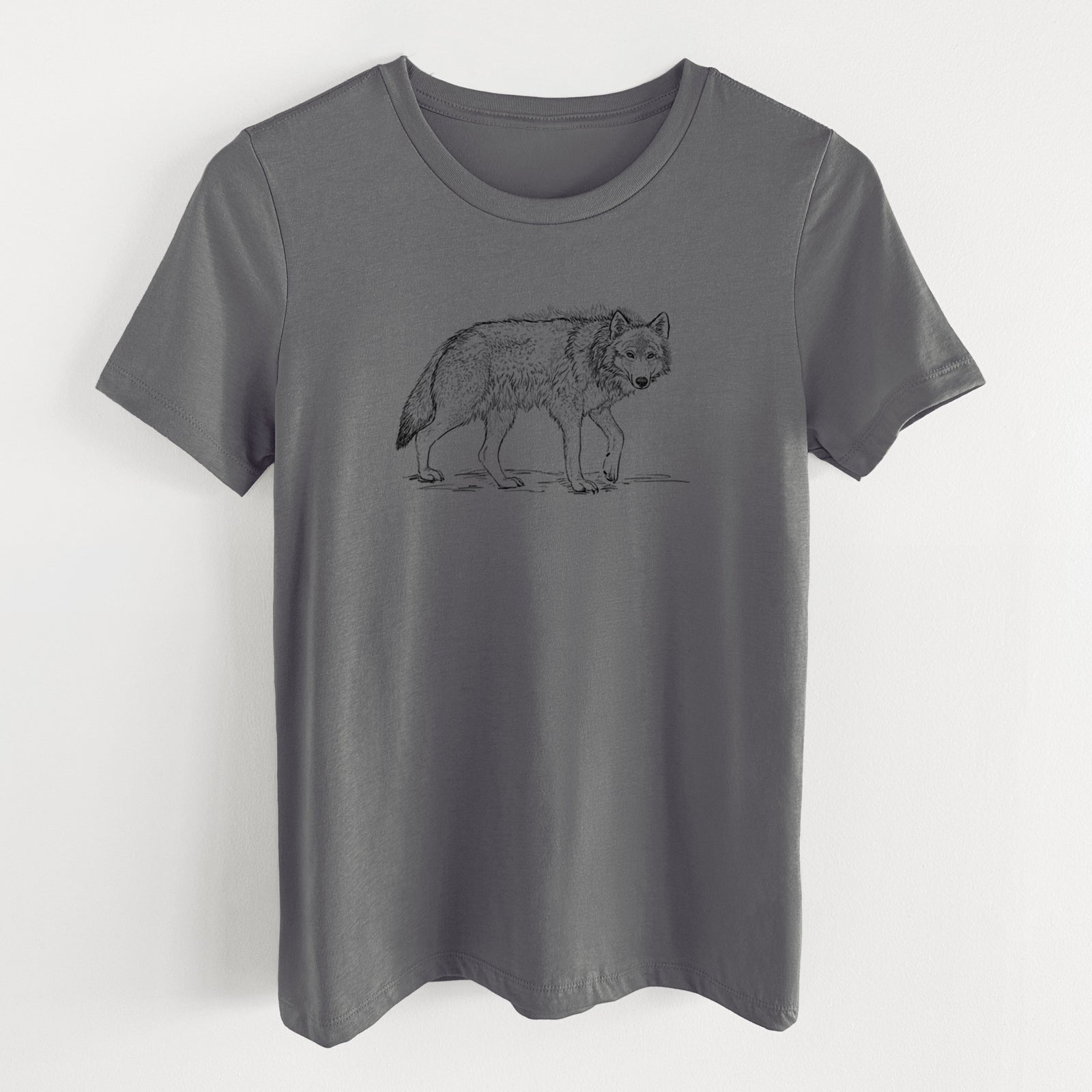 Asphalt women's relaxed fit cotton t-shirt laid flat, printed with a detailed black ink illustration of a grey wolf walking.