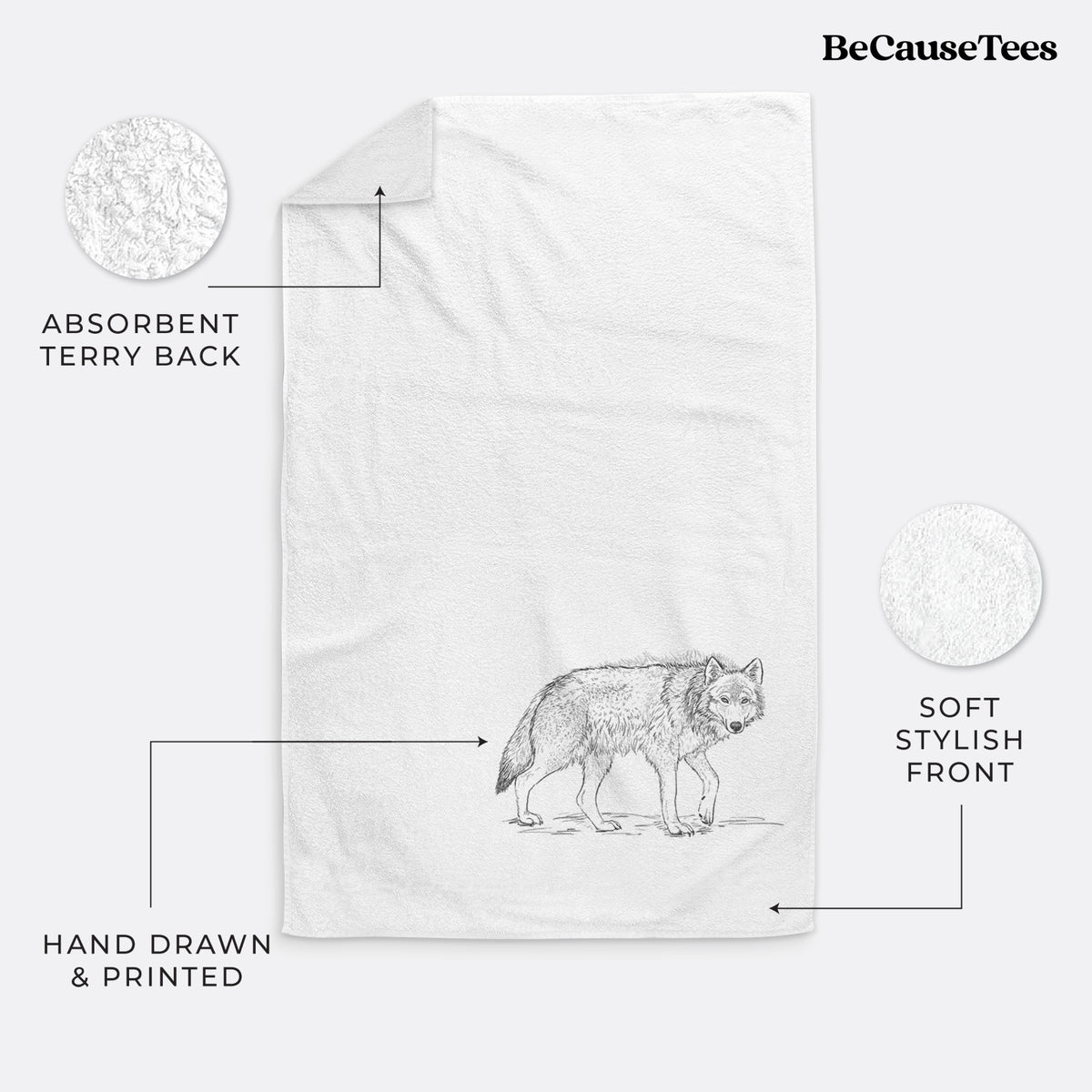 White hand towel printed with a detailed black ink illustration of a grey wolf walking.