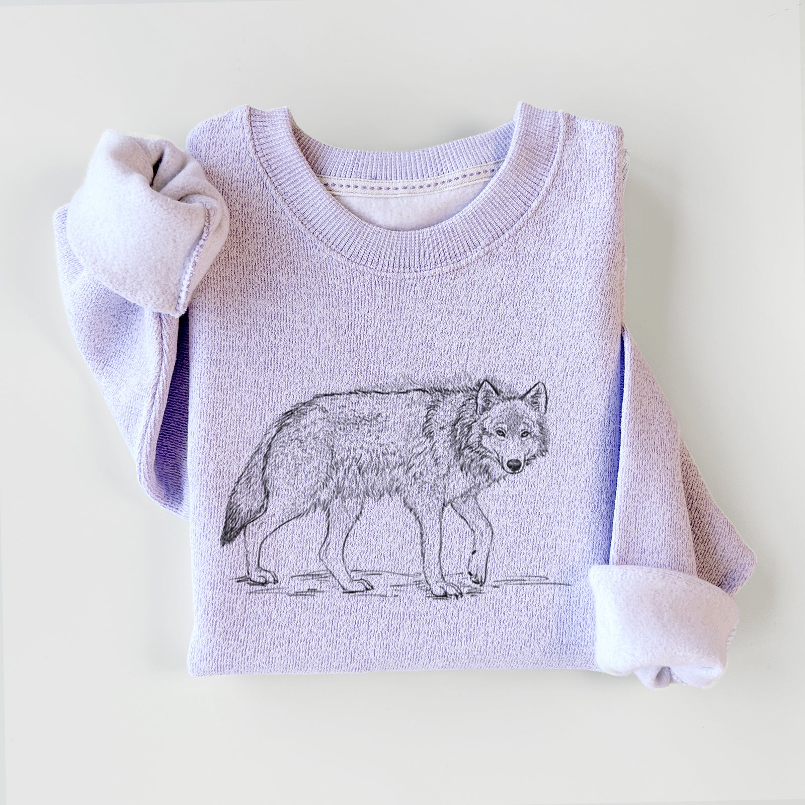 Ice purple knit sweatshirt printed with a detailed black ink illustration of a grey wolf walking, styled flat.
