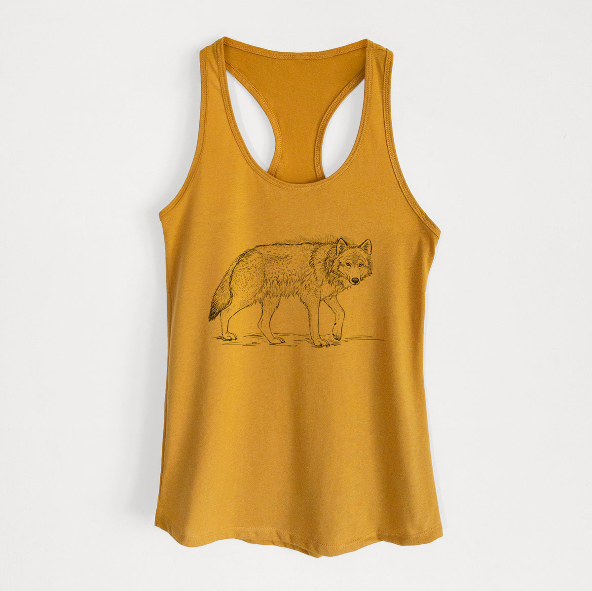 Gold women's racerback tank top laid flat, printed with a detailed black ink illustration of a grey wolf walking.