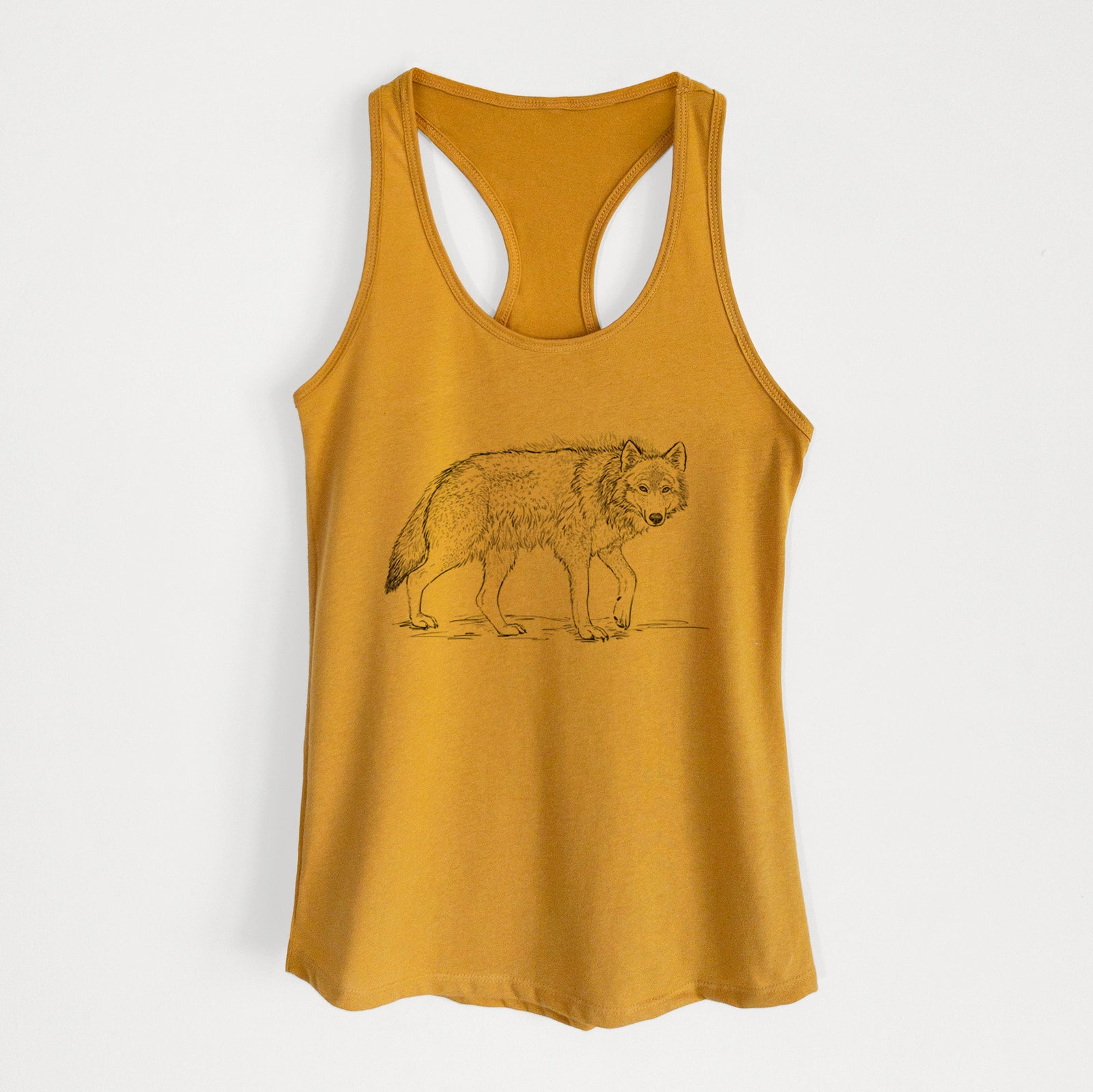 Gold women's racerback tank top laid flat, printed with a detailed black ink illustration of a grey wolf walking.