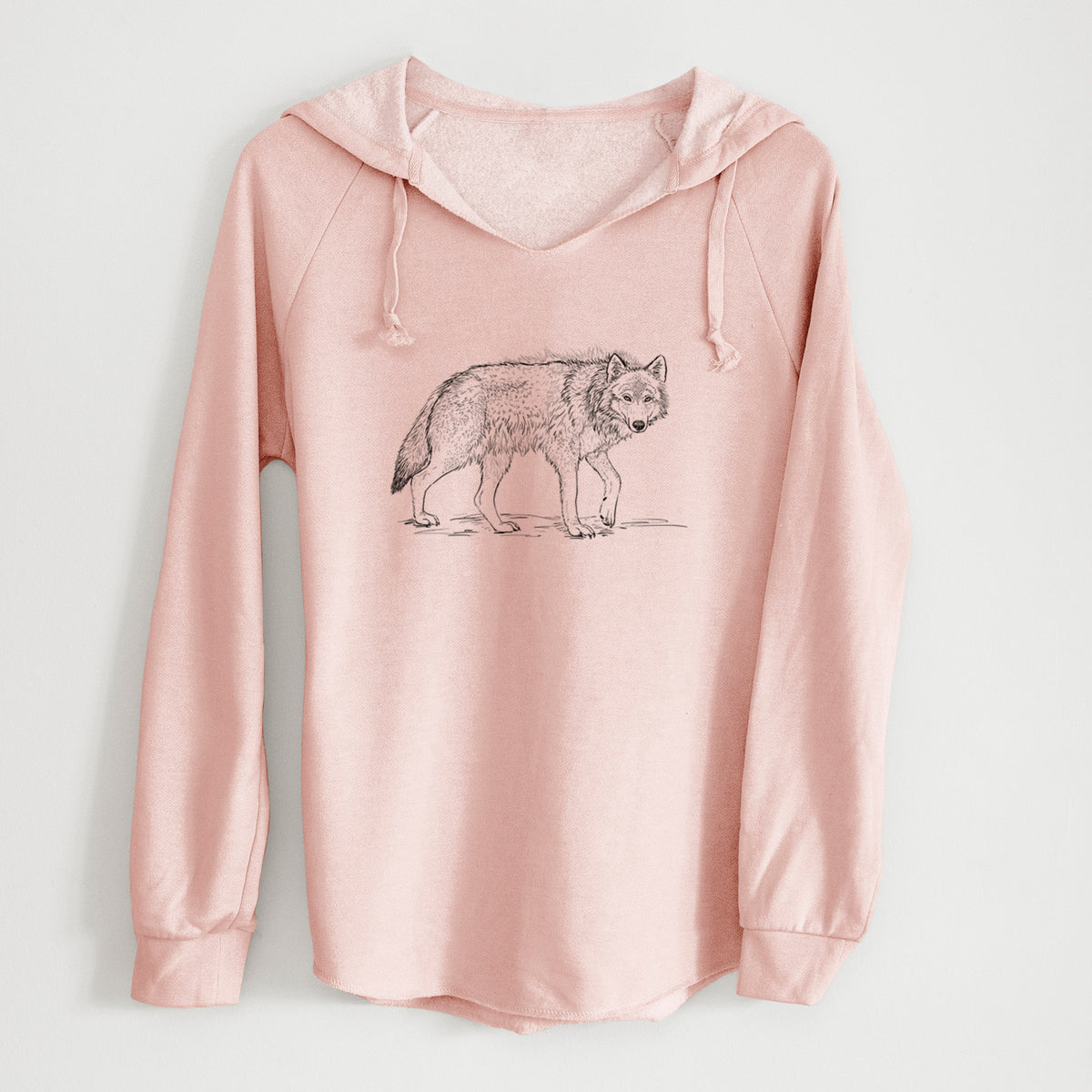 Blush pink women's Cali Wave hooded sweatshirt laid flat, printed with a detailed black ink illustration of a grey wolf walking.