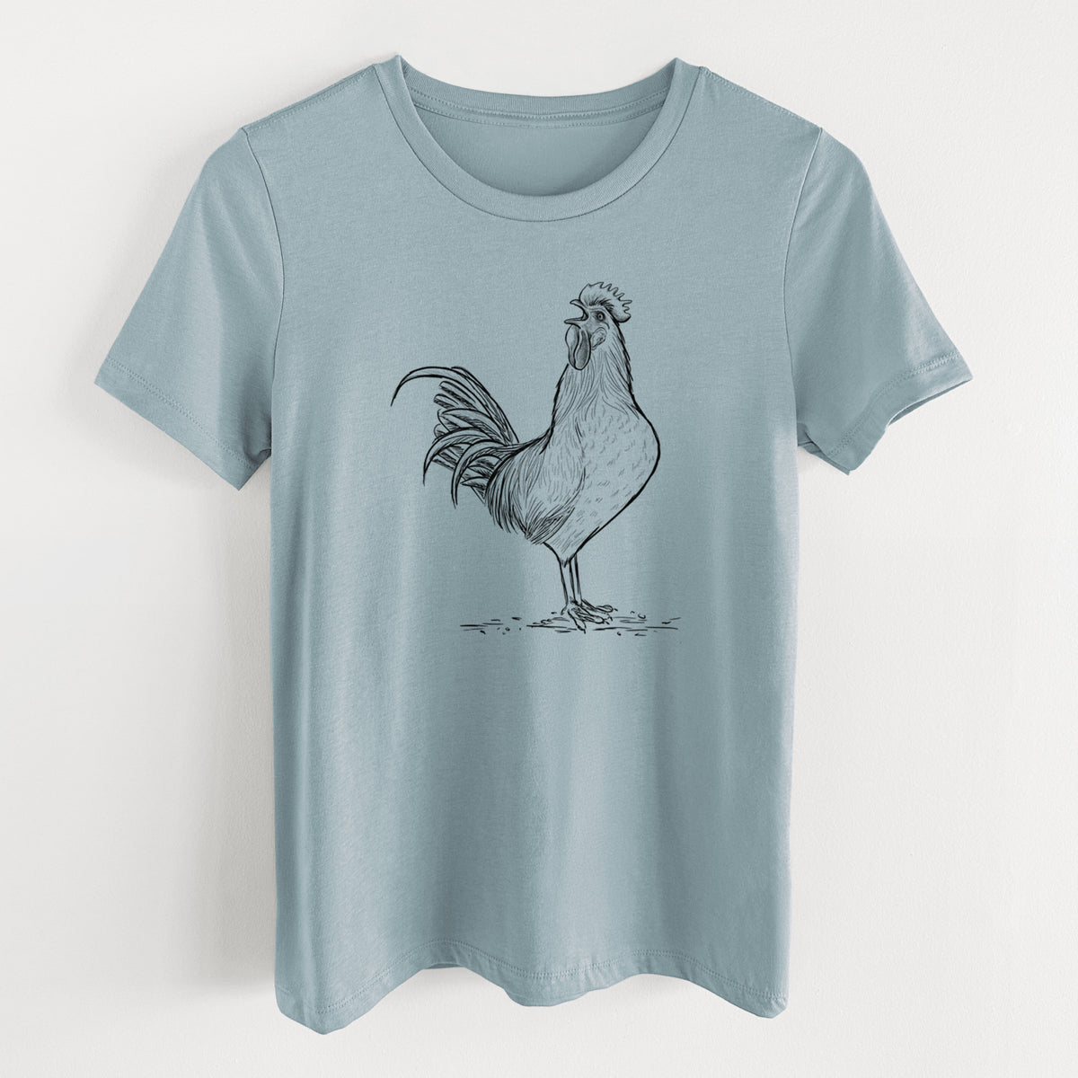 Vintage denim women's relaxed fit cotton t-shirt laid flat, printed with a detailed black ink illustration of a rooster crowing.