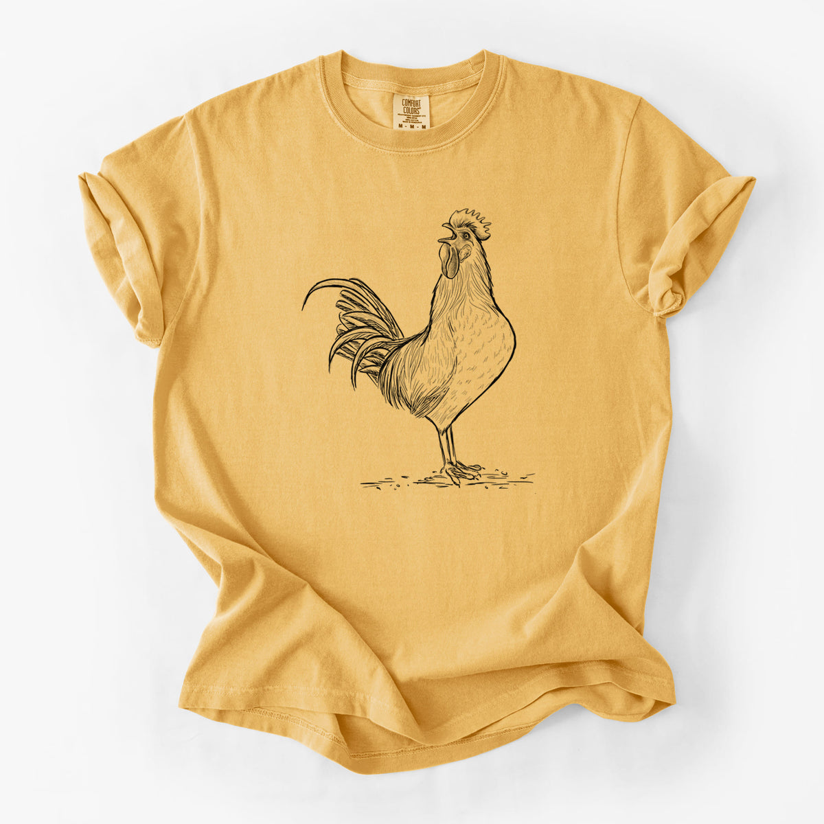 Golden wheat yellow Comfort Colors t-shirt laid flat, printed with a detailed black ink illustration of a rooster crowing.
