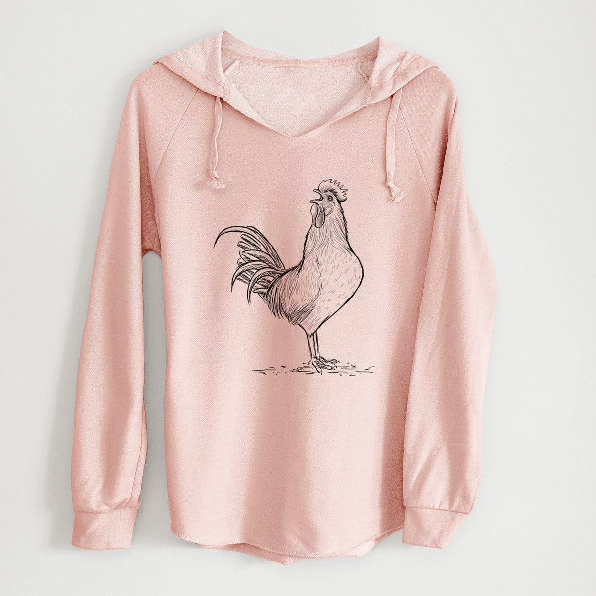 Blush pink women's Cali Wave hooded sweatshirt laid flat, printed with a detailed black ink illustration of a rooster crowing.