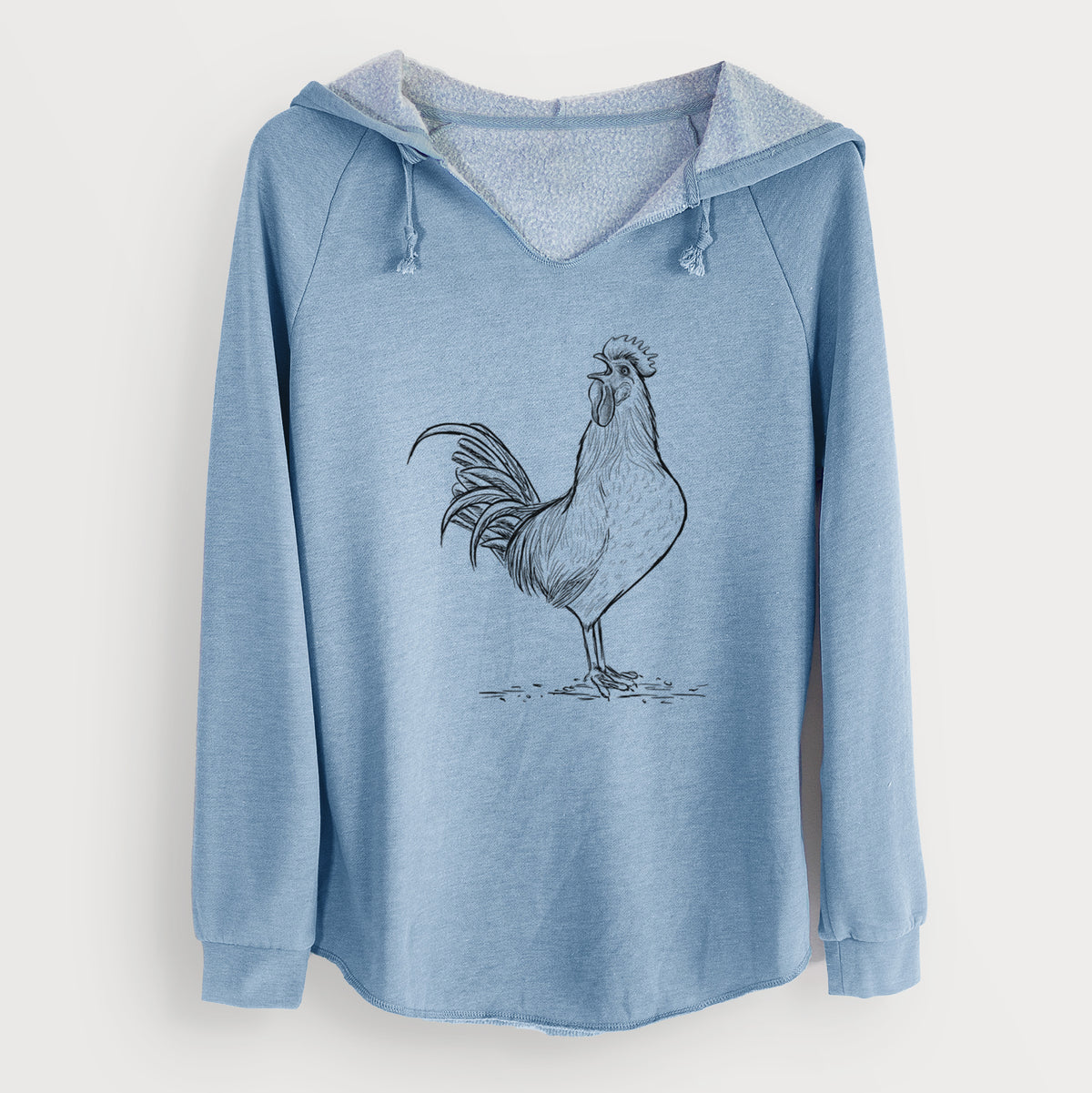 Misty blue women's Cali Wave hooded sweatshirt laid flat, printed with a detailed black ink illustration of a rooster crowing.