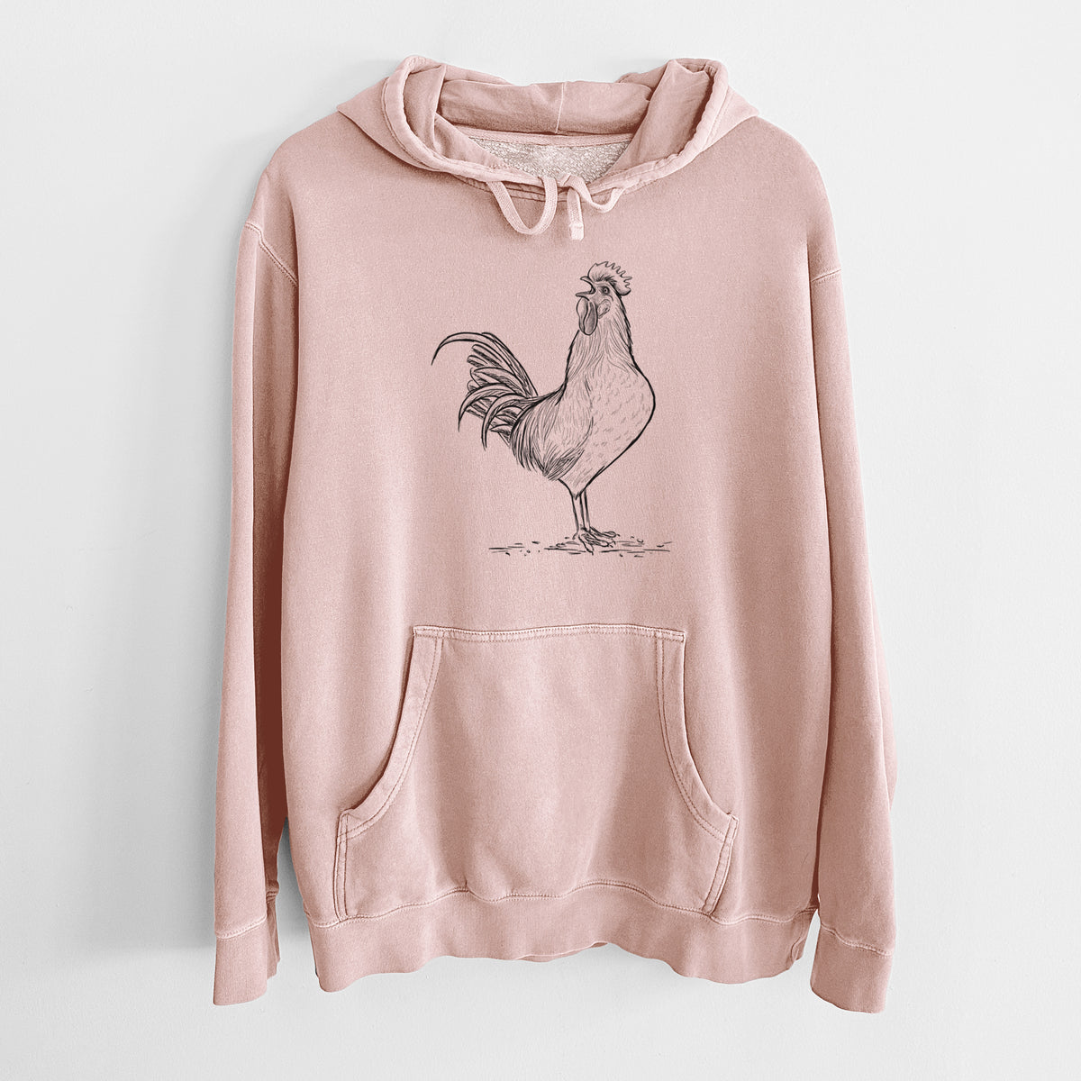 Dusty pink pigment dyed hoodie laid flat, printed with a detailed black ink illustration of a rooster crowing.