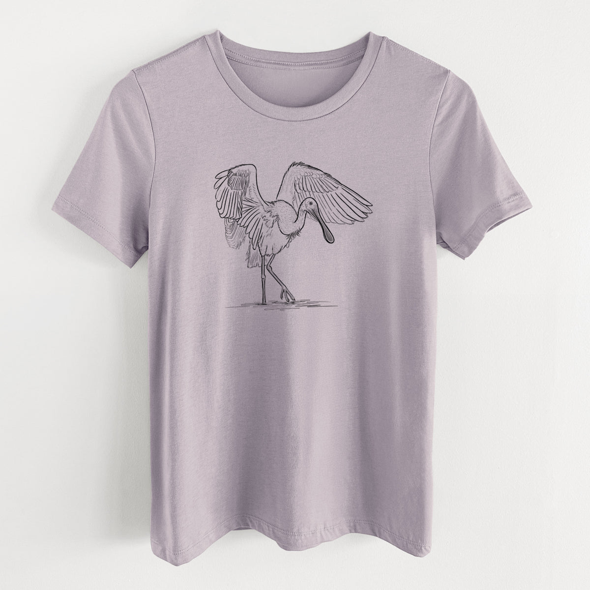 Light violet women's relaxed fit cotton t-shirt laid flat, printed with a black ink illustration of a roseate spoonbill standing with its wings spread.