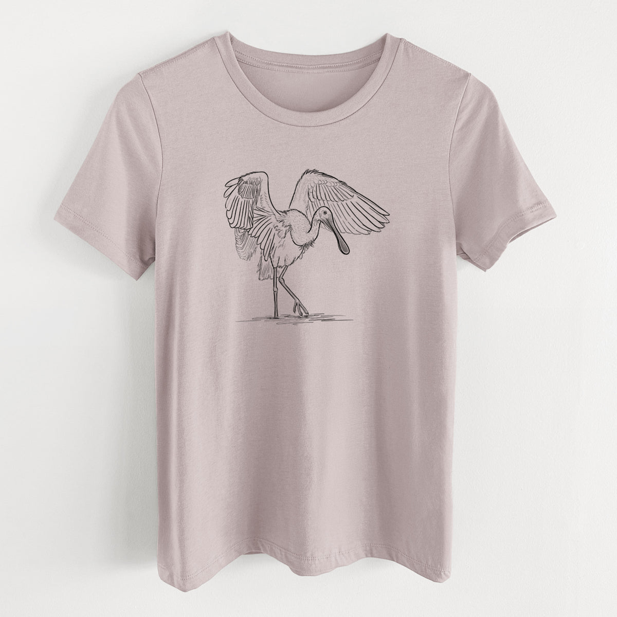 Pink gravel women's relaxed fit cotton t-shirt laid flat, printed with a black ink illustration of a roseate spoonbill standing with its wings spread.