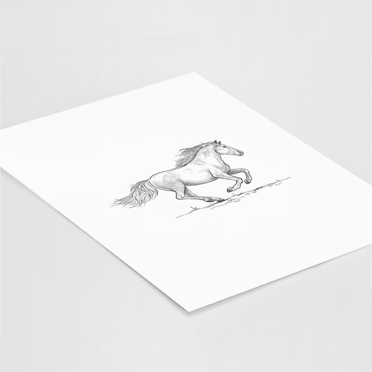 Art print of a black ink illustration of a mustang horse running, lying at an angle on a white surface.