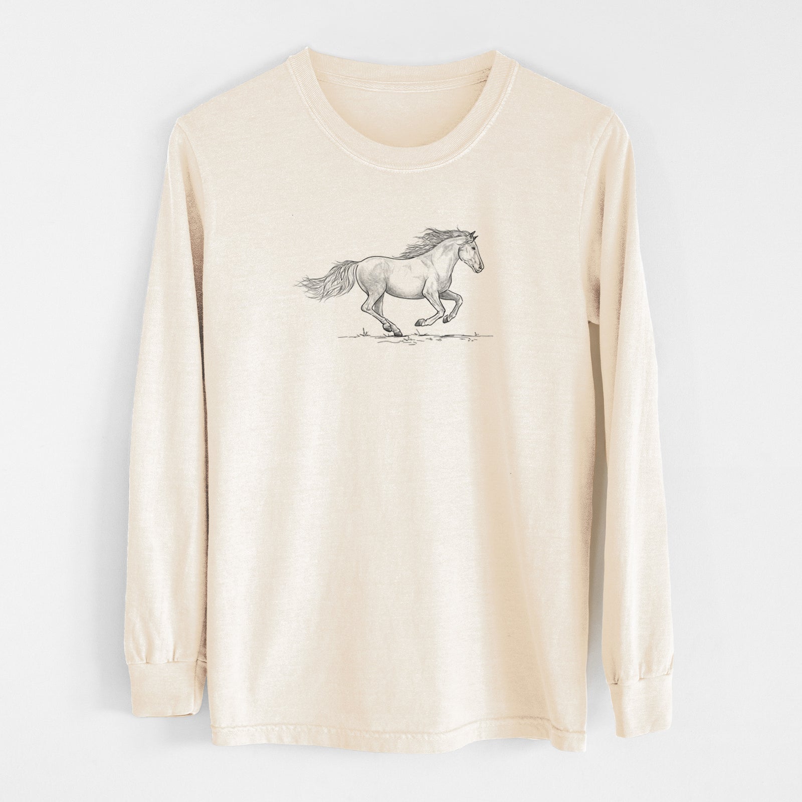 Ivory Comfort Colors long sleeve shirt laid flat, printed with a black ink illustration of a mustang horse running.