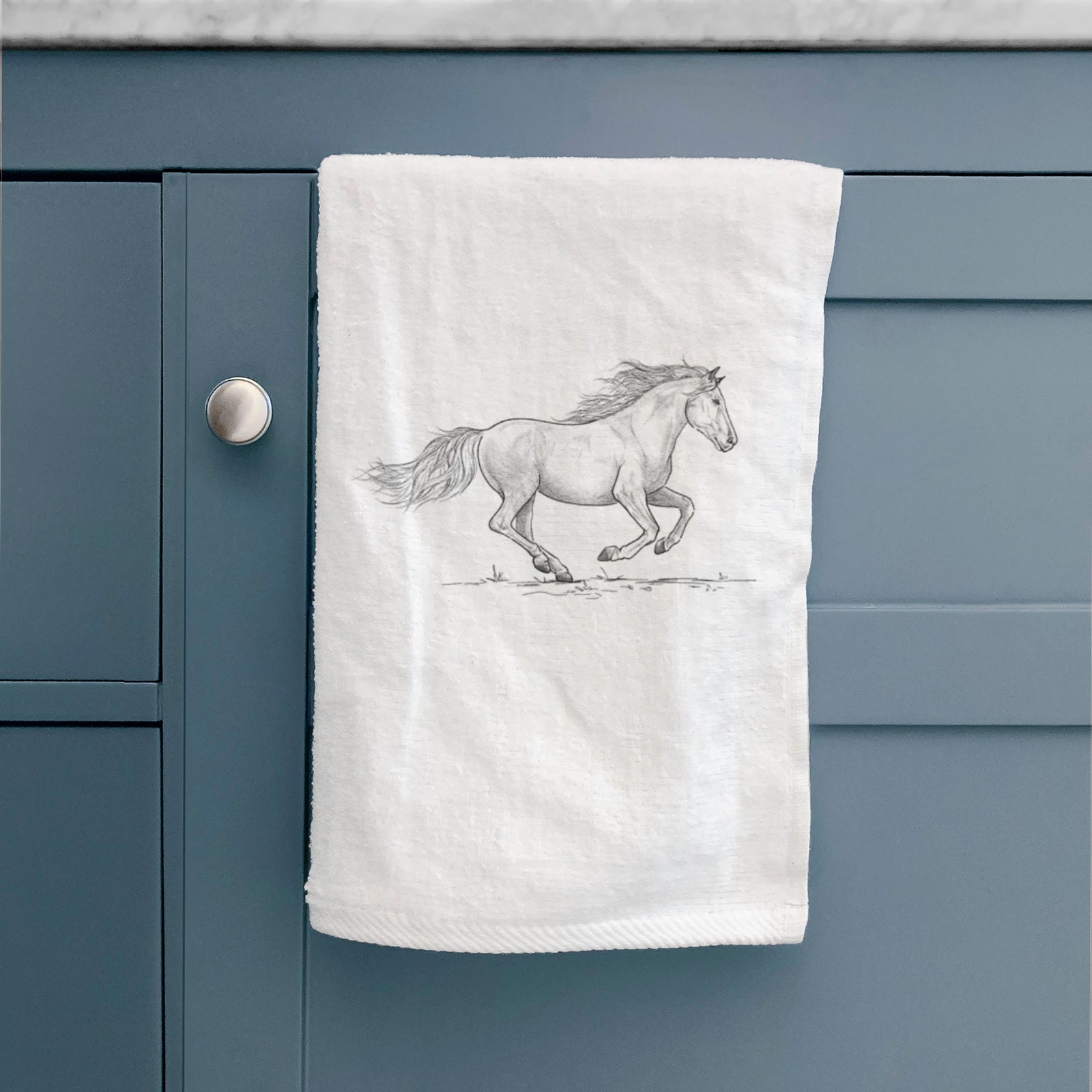 White hand towel printed with a black ink illustration of a mustang horse running.