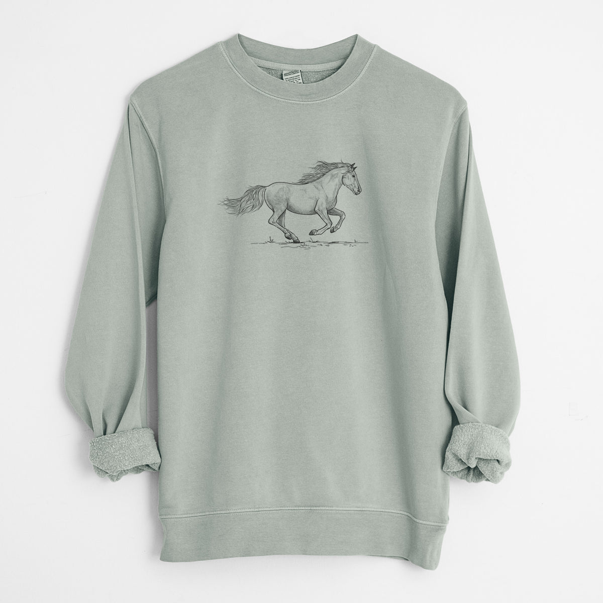 Sage green pigment dyed crewneck sweatshirt laid flat with the sleeves rolled, printed with a black ink illustration of a mustang horse running.