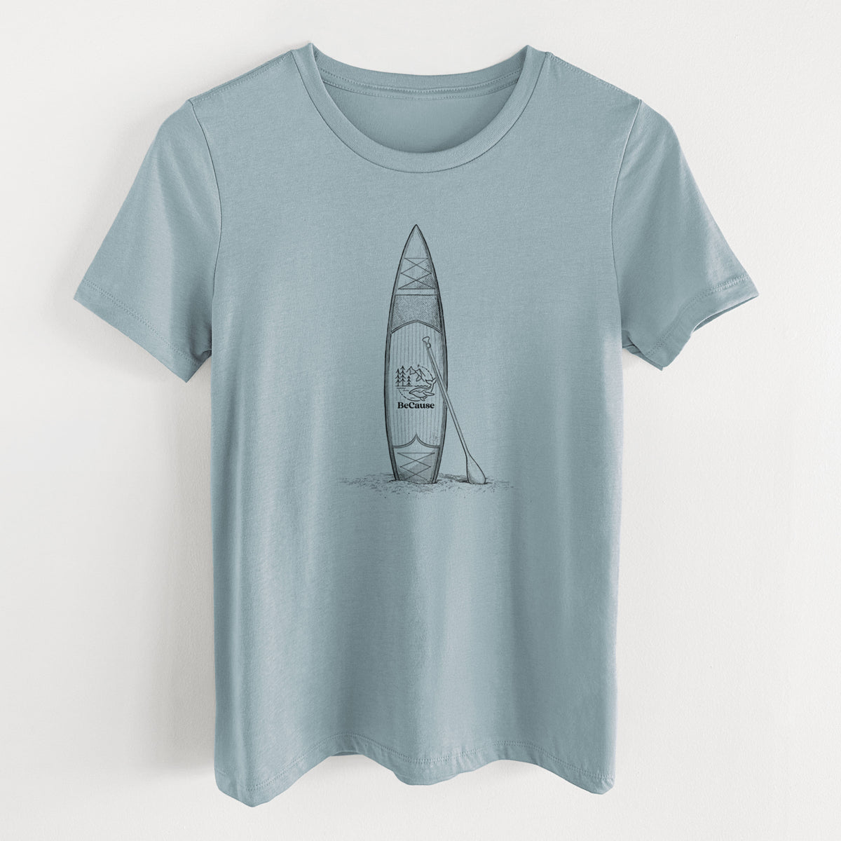 Vintage denim women's relaxed fit cotton t-shirt laid flat, printed with a black ink illustration of a stand-up paddleboard with a paddle.
