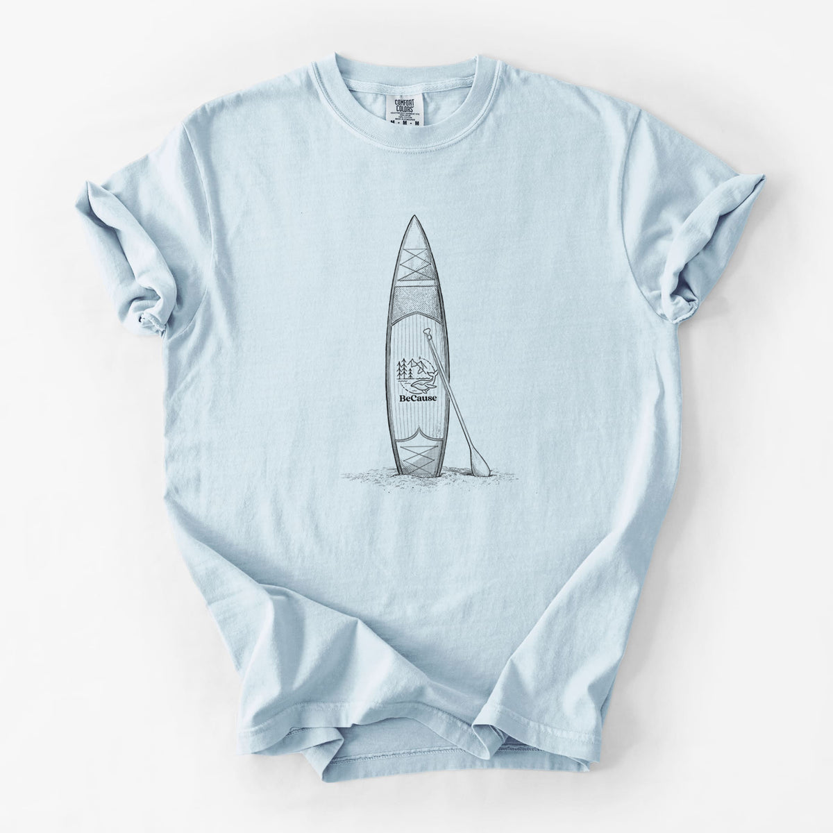 Chambray blue Comfort Colors t-shirt laid flat, printed with a black ink illustration of a stand-up paddleboard with a paddle.