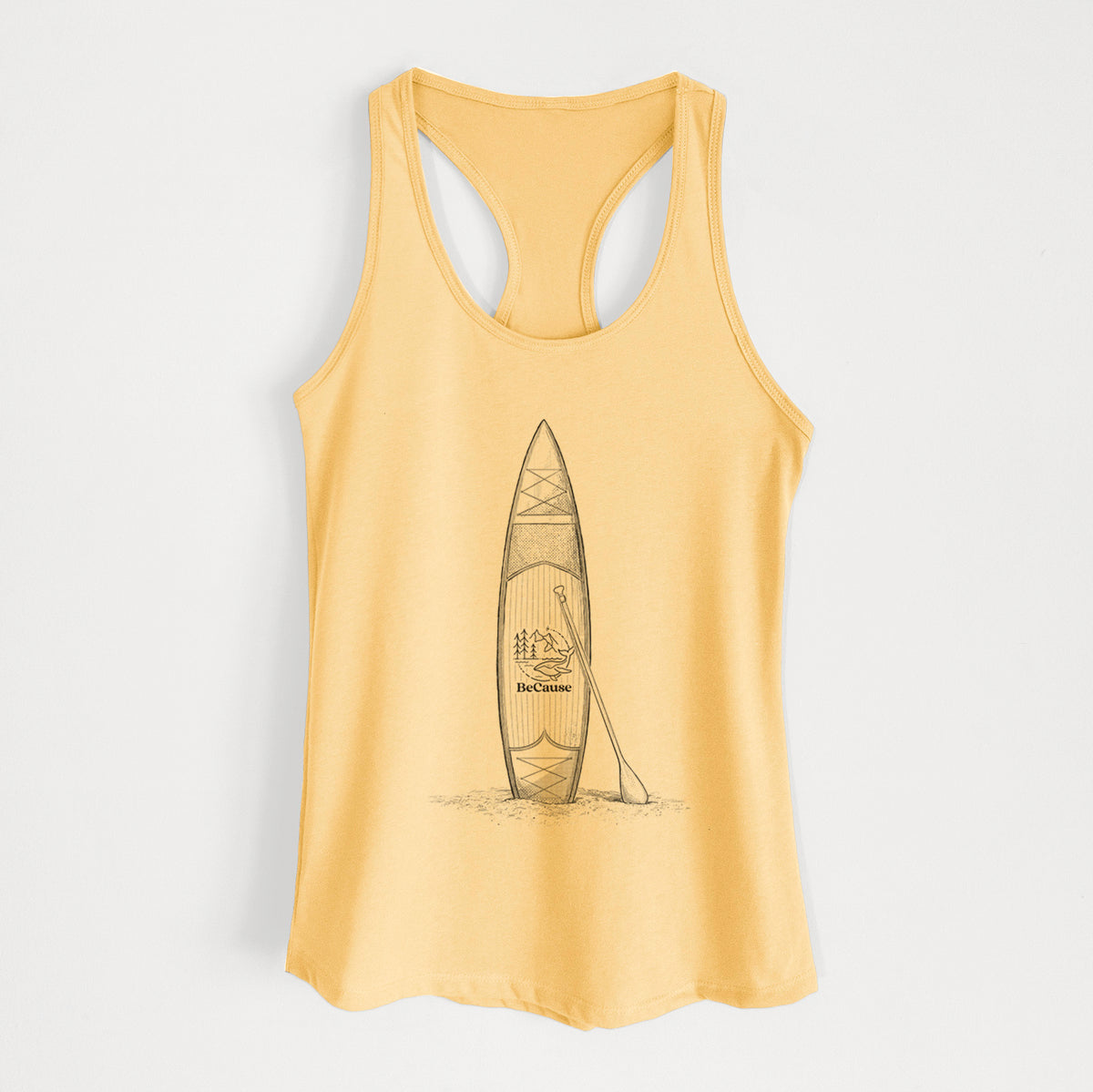 Banana cream women's racerback tank top laid flat, printed with a black ink illustration of a stand-up paddleboard with a paddle.