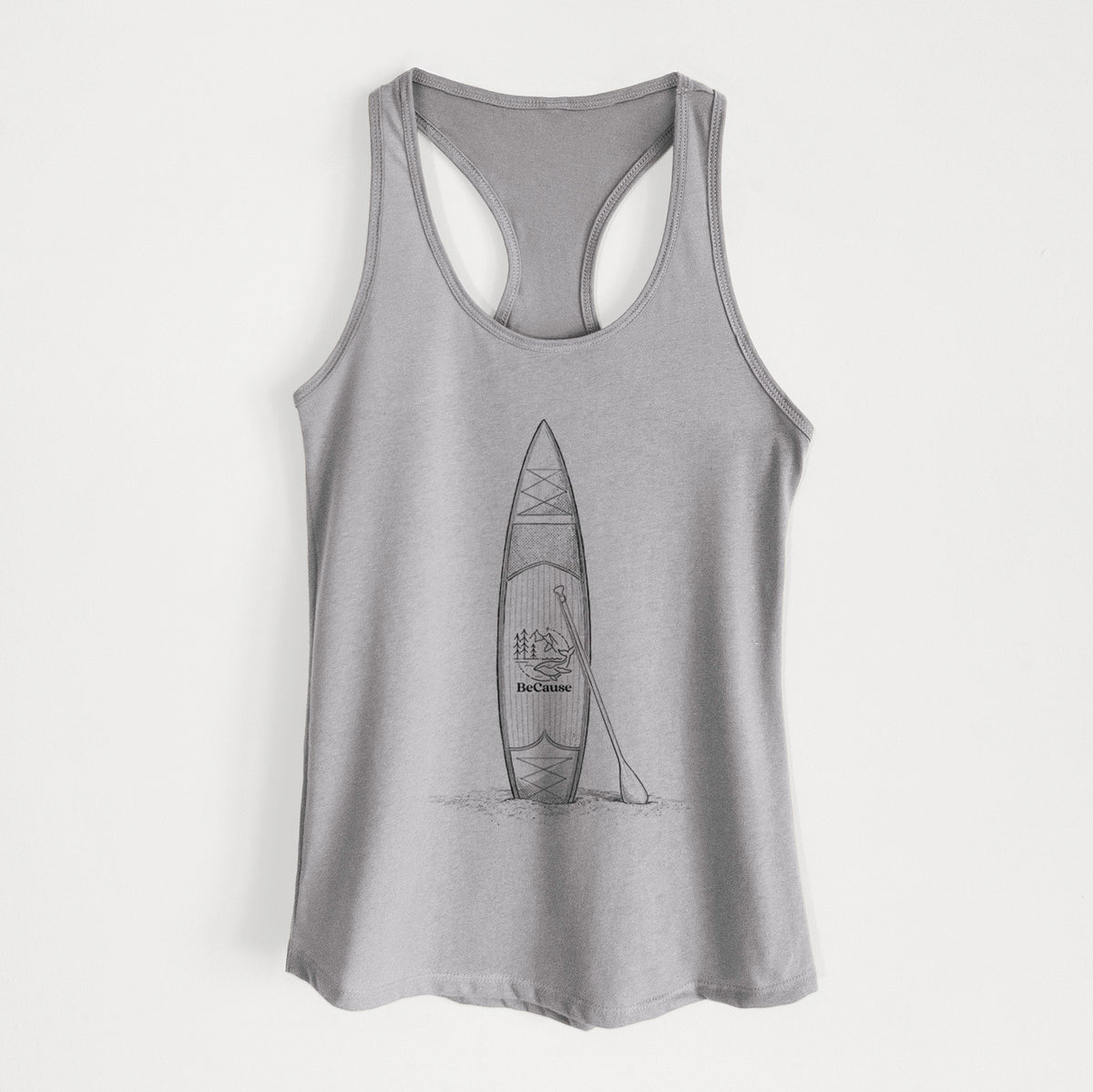 Heather grey women's racerback tank top laid flat, printed with a black ink illustration of a stand-up paddleboard with a paddle.