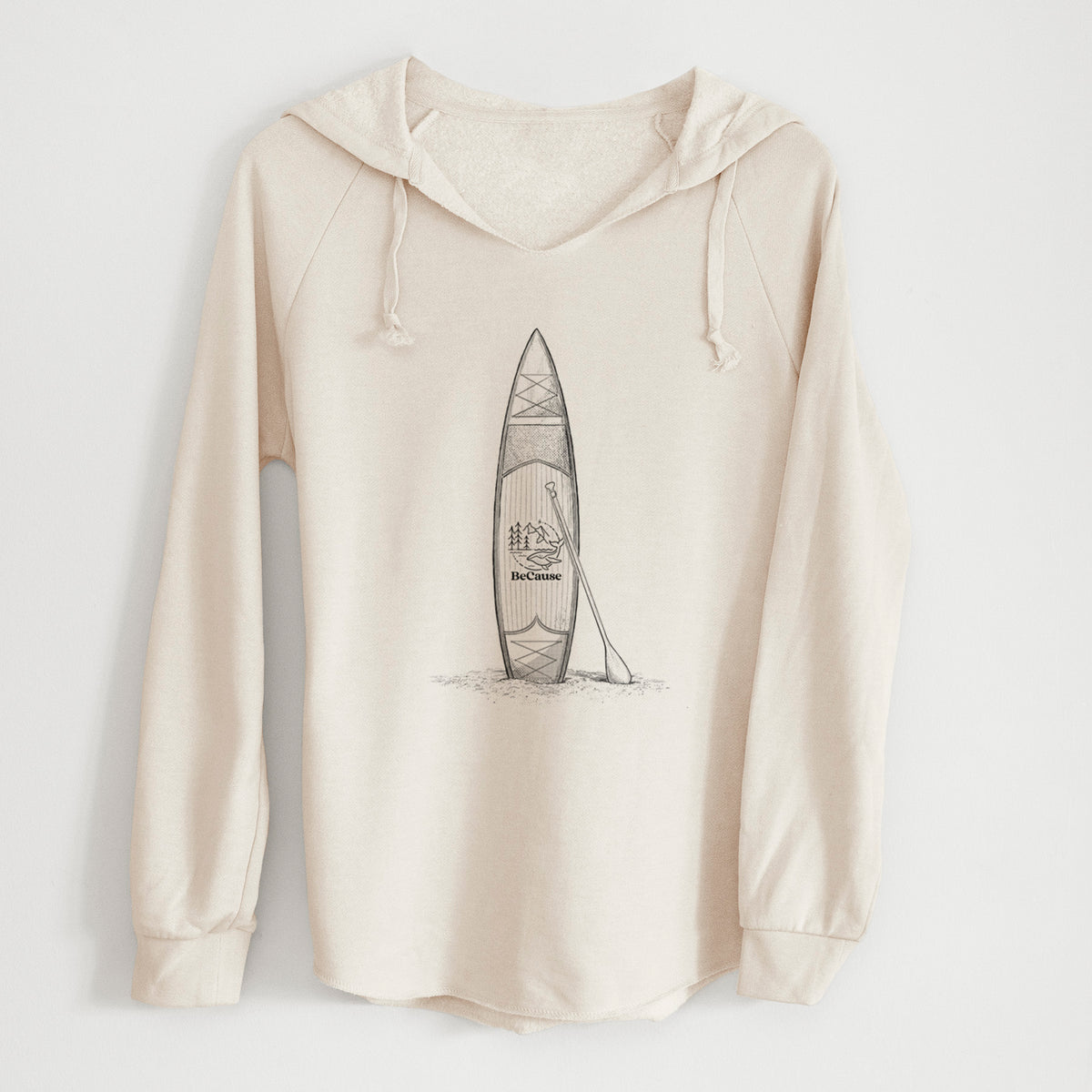 Bone cream women's Cali Wave hooded sweatshirt laid flat, printed with a black ink illustration of a stand-up paddleboard with a paddle.