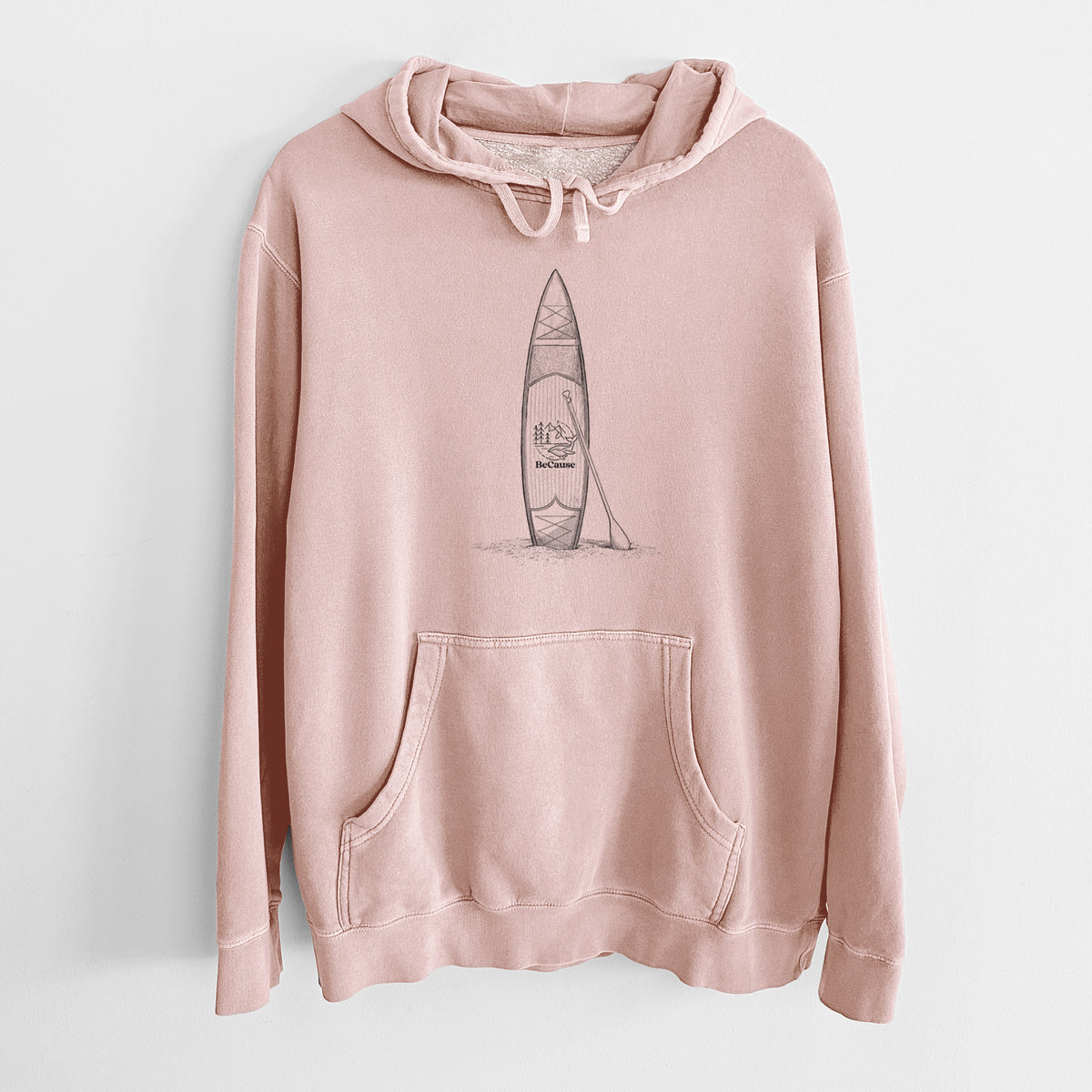 Dusty pink pigment dyed hoodie laid flat, printed with a black ink illustration of a stand-up paddleboard with a paddle.