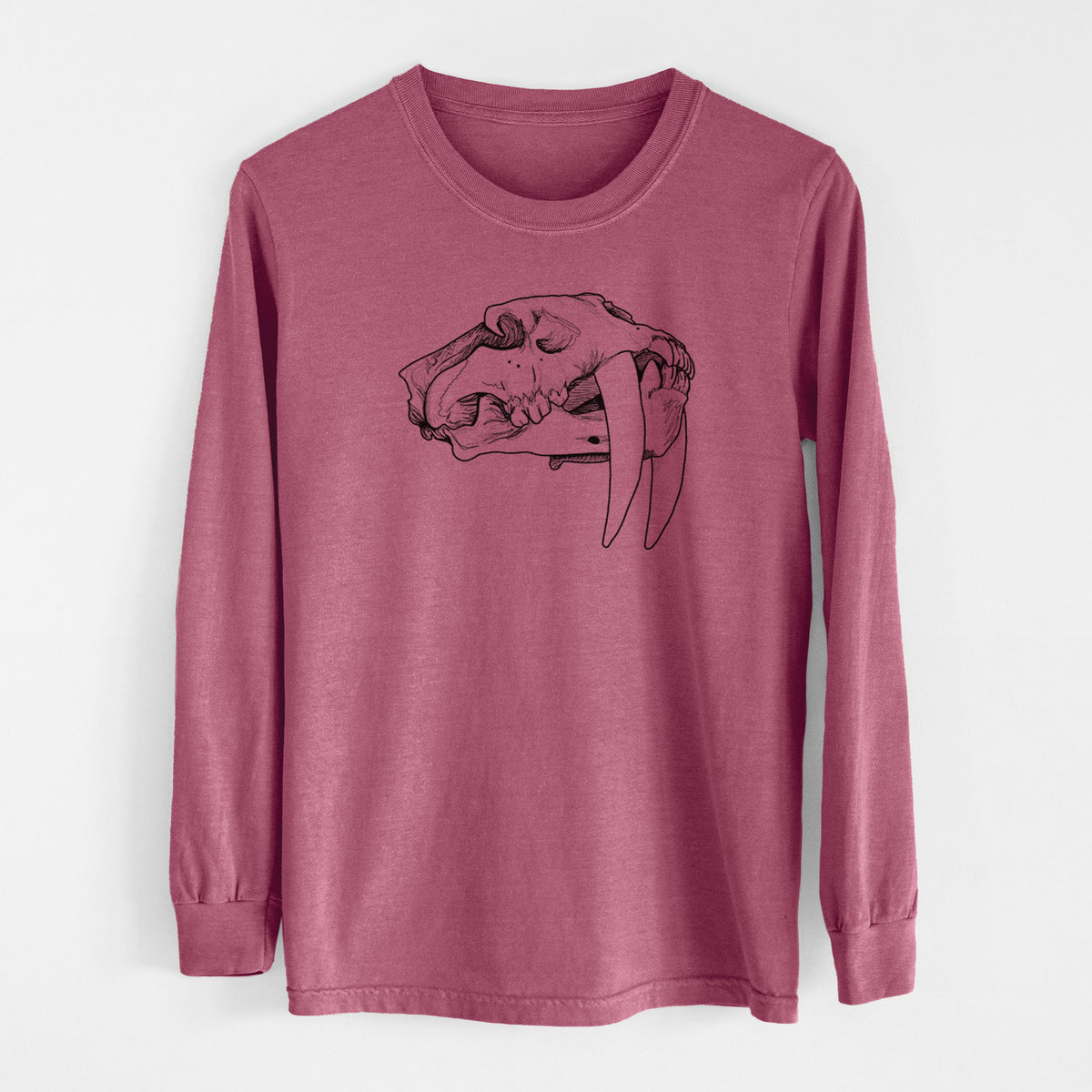 Crimson Comfort Colors long sleeve shirt laid flat, printed with a detailed black ink illustration of a saber-toothed tiger skull.