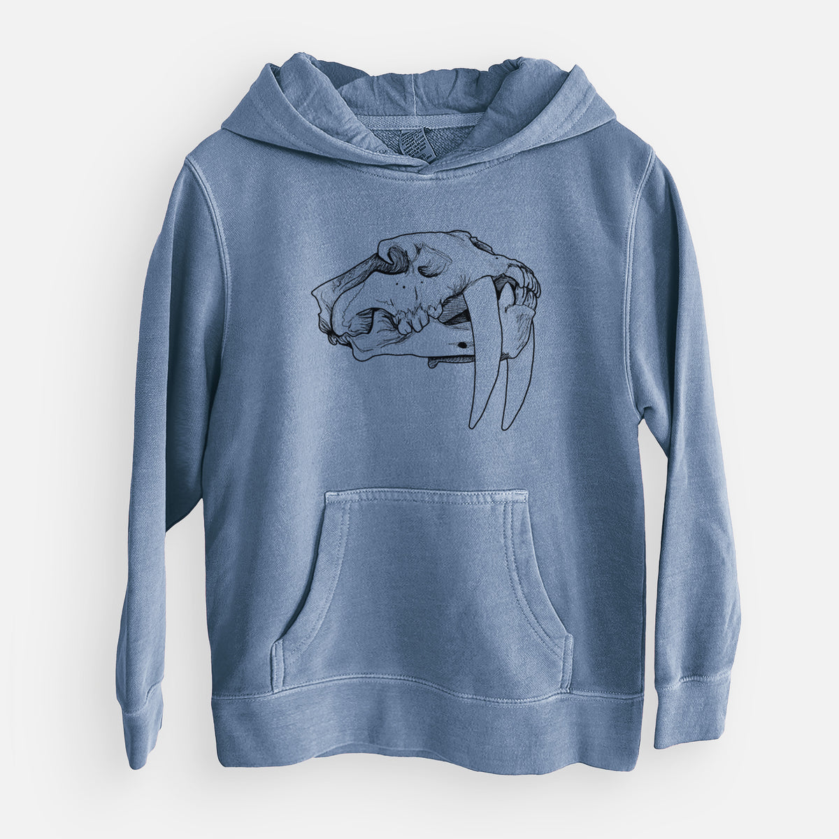 Slate blue youth pigment dyed hoodie laid flat, printed with a detailed black ink illustration of a saber-toothed tiger skull.
