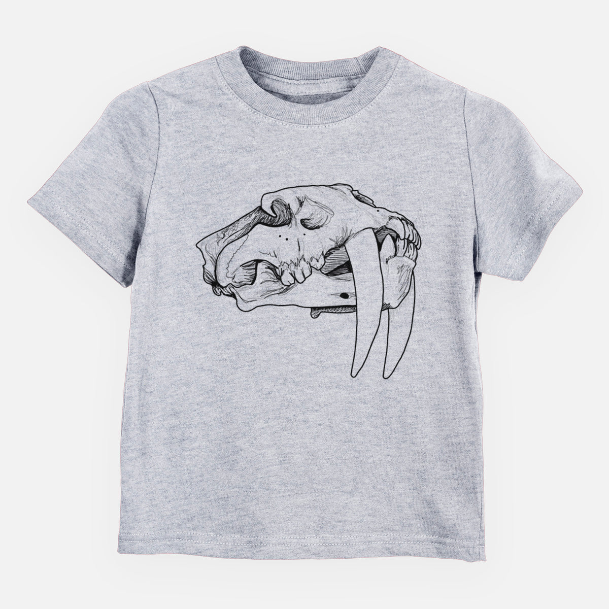 Heather grey toddler t-shirt laid flat, printed with a detailed black ink illustration of a saber-toothed tiger skull.