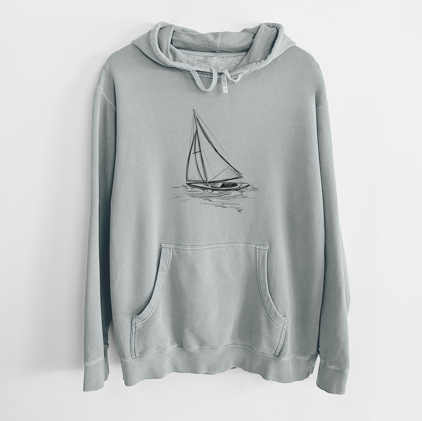 Sage green pigment dyed hoodie laid flat, printed with a black ink illustration of a sloop sailboat on the water.