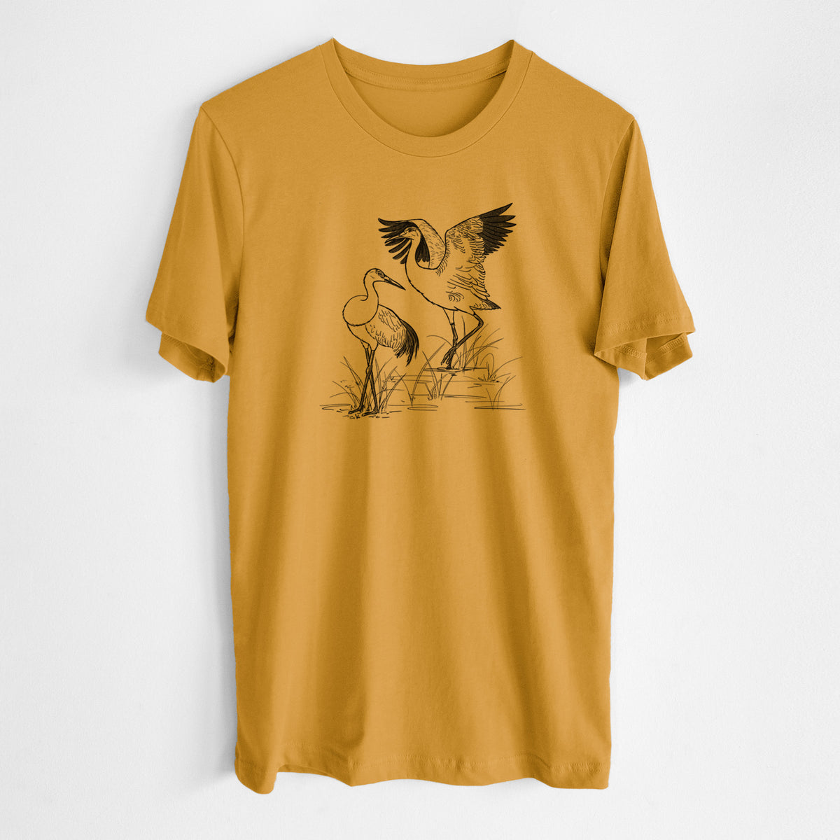 Honeycomb yellow lightweight cotton t-shirt laid flat, printed with a black ink illustration of two sandhill cranes in marsh grass, one with its wings raised.