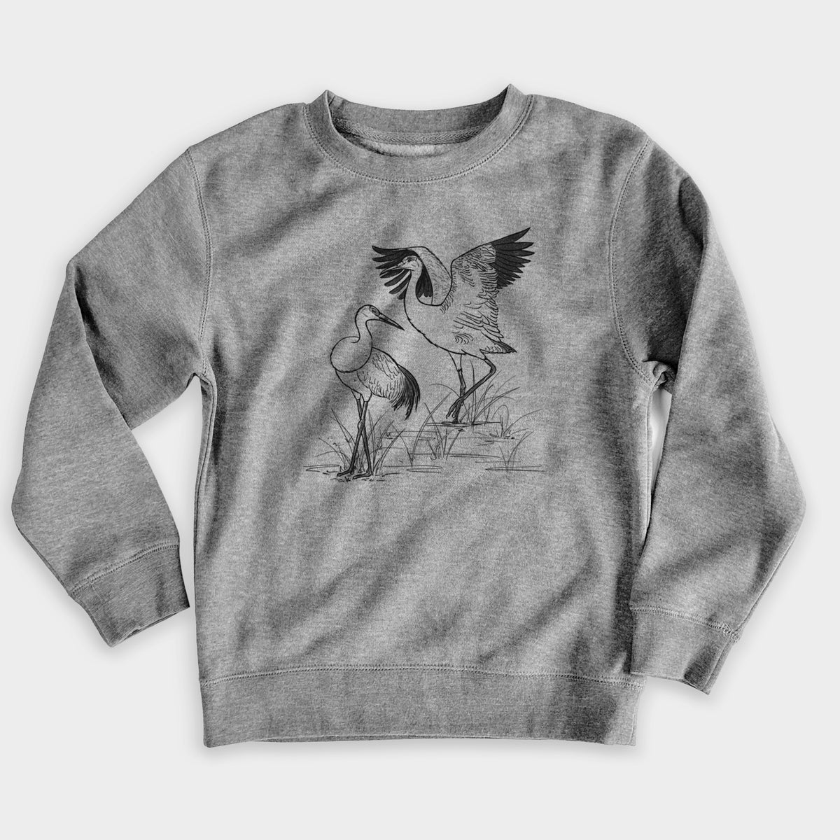 Nickel grey youth crewneck sweatshirt laid flat, printed with a black ink illustration of two sandhill cranes in marsh grass, one with its wings raised.