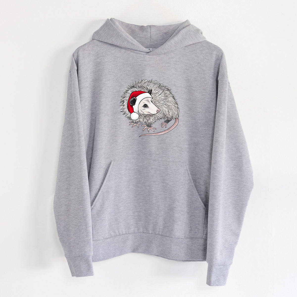 Santa Opossum - Statement Midweight Hoodie in Heather Grey, hanging on a white wall, with a front kangaroo pocket and no drawcords.