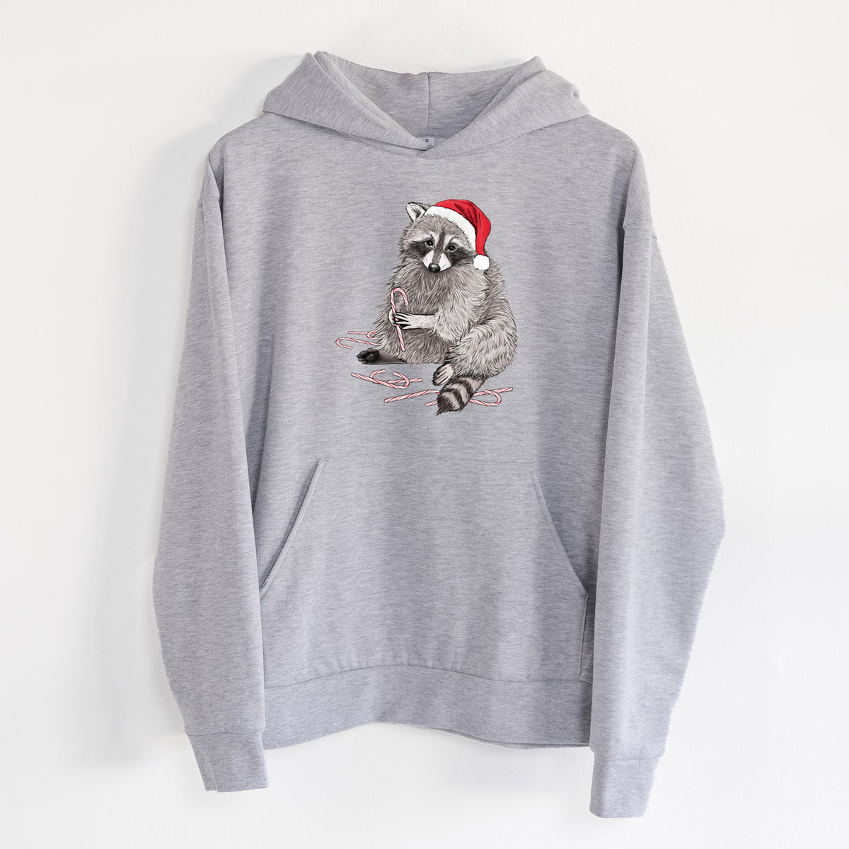 Santa Raccoon - Statement Midweight Hoodie in Heather Grey, hanging on a white wall, with a front kangaroo pocket and no drawcords.