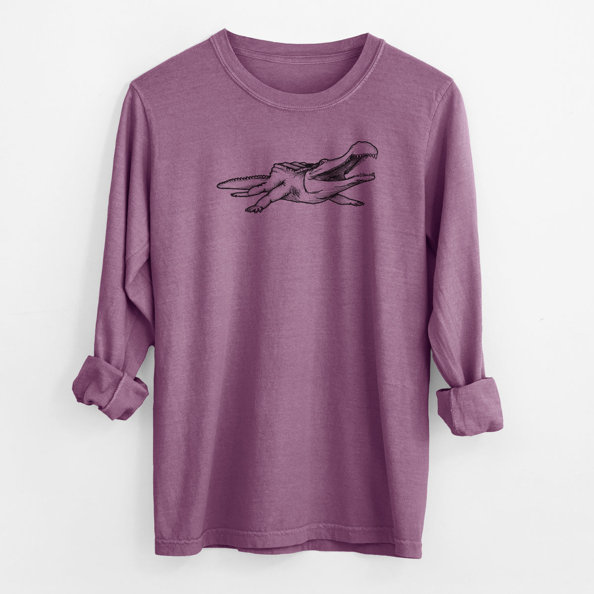 Berry pink Comfort Colors long sleeve shirt laid flat with the cuffs rolled, printed with a black ink illustration of a Sarcosuchus, a giant prehistoric crocodile.