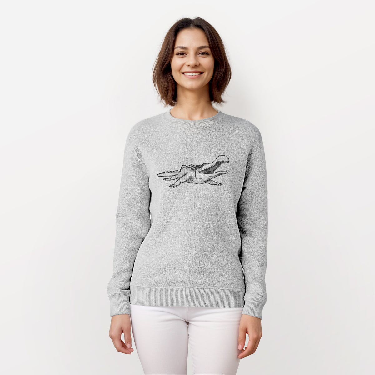 Woman wearing a knit sweatshirt printed with a black ink illustration of a Sarcosuchus, a giant prehistoric crocodile.