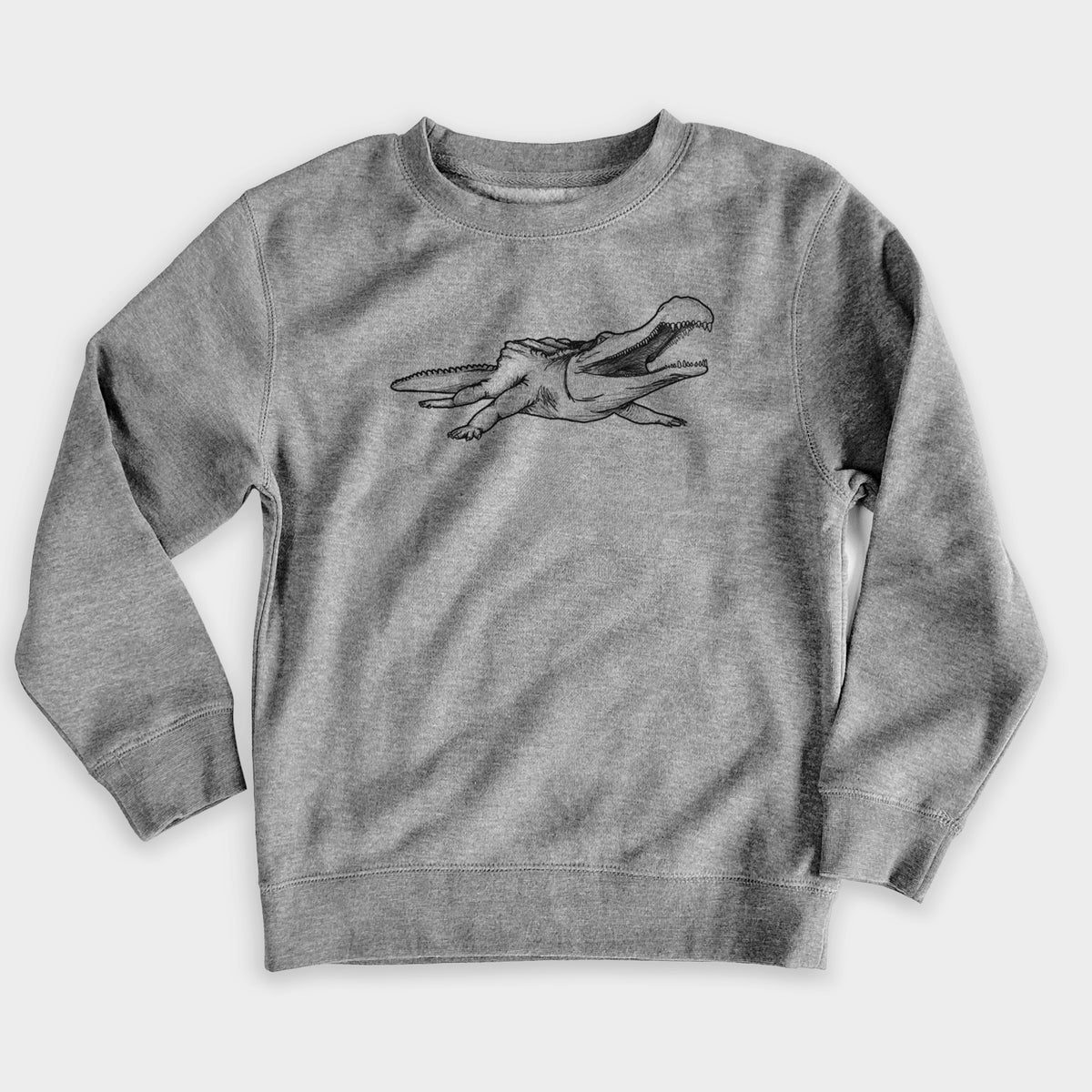 Nickel grey youth crewneck sweatshirt laid flat, printed with a black ink illustration of a Sarcosuchus, a giant prehistoric crocodile.